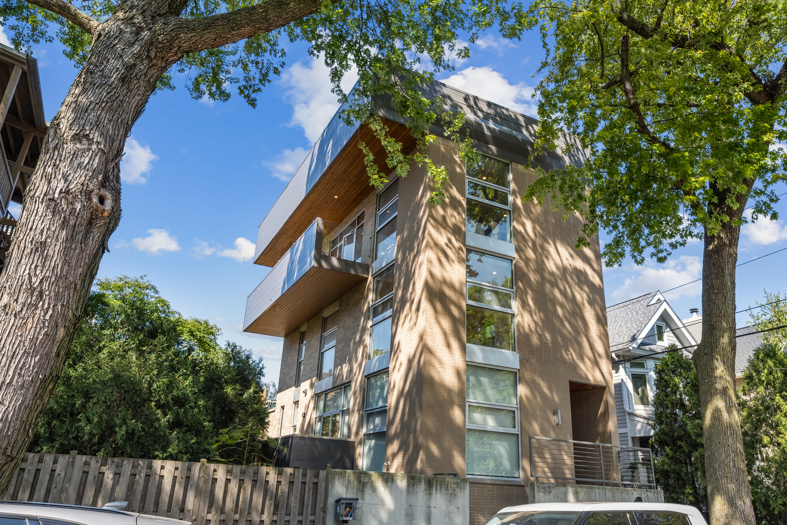 One-of-a-kind luxury living in the heart of Lincoln Park. This stunning 3BR+Office/2.5BA three-level condo, set in an all-brick two-unit building, was fully renovated in 2021 with first-class finishes and thoughtful design throughout. The bright and airy main level impresses with soaring ceilings and floor-to-ceiling windows that flood the home with natural light. A sleek, modern chef's kitchen anchors the space, featuring custom European cabinetry, Calacatta Trevi quartz countertops, a Sub-Zero 36" refrigerator/freezer, Wolf cooktop, microwave, convection oven, and Bosch dishwasher. Flowing seamlessly from the kitchen, the open-concept living and dining area extends outdoors to a private wraparound deck, perfect for entertaining or dining al fresco among the treetops. The second level hosts three spacious bedrooms and two spa-like baths adorned with Arctic White quartz vanities and Kohler fixtures. The primary suite is a true retreat with a professionally organized walk-in closet and a luxurious en-suite bath complete with a steam shower. Crowning the home is a spectacular rooftop oasis with brand-new Trex decking, a built-in pergola, and sweeping skyline views. A bonus room on this level offers the flexibility for a home office, fitness studio, or lounge. Additional highlights include all-new windows, wide-plank white oak hardwood flooring throughout, motorized blinds, private entrance and an attached garage for secure parking. Unbeatable location, nestled on a tree-lined street in Lincoln Park, this home offers easy access to parks, playgrounds, the Lakefront trail + beaches. Enjoy the neighborhood's vibrant dining scene, boutiques, coffee shops, and nightlife, with convenient proximity to Whole Foods + Trader Joe's. The Brown and Purple lines are just blocks away, making commuting effortless. Top rated Alcott School + Lincoln Park High School! This is a rare opportunity to own a truly extraordinary residence blending modern luxury with the best of Chicago's Lincoln Park lifestyle.