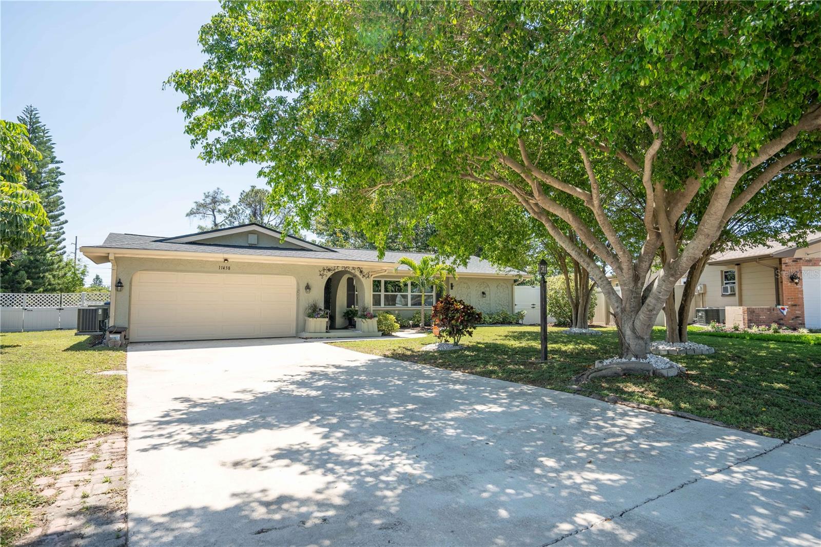 One or more images have been virtually staged. Located in the established Orangewood Estates community, this well-maintained 3 bedroom, 2 bath, 2 car garage home sits on a spacious 0.31-acre corner lot, offering both privacy and room to spread out!! The home has seen Significant updates, including a remodeled kitchen (2022) with quartz countertops, shaker soft-close cabinetry, a stainless steel farm sink, and reverse osmosis water filtration. The roof and windows were replaced in 2020, with a new HVAC system and water heater added in 2024, and a new pool pump and filter installed in 2025. The interior features fresh paint throughout, updated outlets, switches, lighting, and fans, along with luxury vinyl plank flooring and tile in wet areas. The primary bathroom has been renovated with dual vanities and a glass-enclosed tiled shower. The backyard is fully fenced with mature landscaping and a large concrete inground pool, creating a private outdoor space that’s easy to enjoy year-round. Ideally located less than 10 minutes from Indian Rocks Beach and just around the corner from Largo Mall, this home offers convenience without sacrificing a quiet neighborhood setting. No HOA, no CDD, no flood insurance required, and no history of flooding. Owned and cared for by the same owner for 30 years.