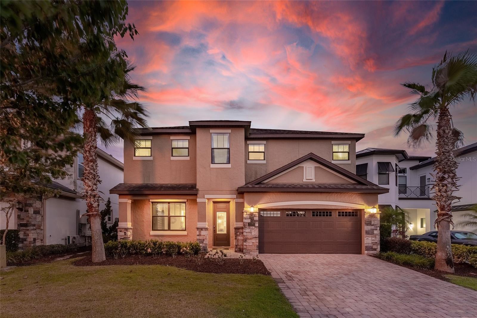 Looking for the perfect family getaway? Look no further as this newly furnished 6 bedrooms, 5.5 bathroom has everything you need for an unforgettable vacation. This home features 3,361 sq. ft. of elegant living, games room, custom-built kids bedrooms, an extended pool area.
From the moment you step through the door, you will be blown away by the beautiful decor throughout. The open kitchen allows you to prepare delicious meals for all. Right through the sliding patio doors, you will have your own private oasis. The pool area is newly extended to provide more fun for your vacation. It features a private pool, spillover spa, tiki bar with BBQ grill, and firepit. Soak up the Florida sun in one of the 6 sun loungers or unwind in the daybed. If looking for a little more fun, then challenge someone for a game of ping pong, basketball, mega chess, cornhole, or connect 4. You can even work on your golf game on your personal putting green. Everyone will have a great time by the pool area with all that it has. You can dine al fresco at the outdoor dining table. Relax at the tiki bar with a built-in BBQ Grill with rotisserie where you can prepare a delicious meal.  There is also convenient access to a half bathroom through the covered lanai. 
There is more fun inside the home for everyone to enjoy. The villa features a custom games room with plenty of arcades and games for all ages to enjoy. The gamers in the family will enjoy the 2-TV gaming system with Xbox One and Playstation 4 consoles to play their favorite games. The games room also has a commercial Air Hockey table, Basketball, Skeeball, Terminator, and Dead Heat Rider arcade games. Plus Arcade Legends which has over 100 games, including all the classics and Golden Tee. Reunion Resort offers 3 signature golf courses, tennis center, state of the art water park with lazy river, 14 community pools, 5 restaurant areas, playgrounds, organized activities and so much more. The resorts proximity to all of the major theme parks, especially Disney World, being just 6 miles away, makes this vacation community a top choice for visitors of all ages.