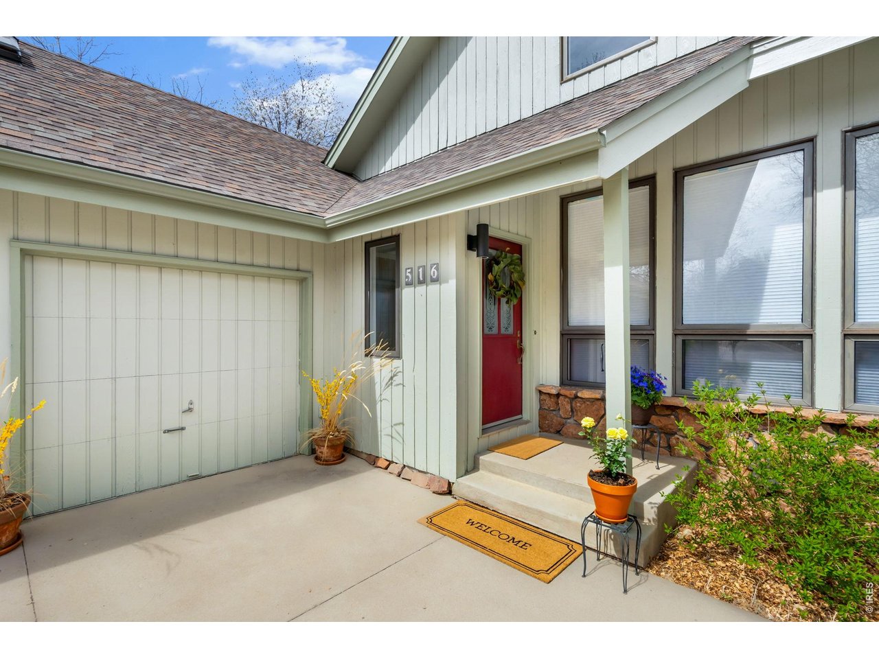 Tucked away on a quiet cul-de-sac in The Landings, 516 Spring Canyon Court is a true architectural statement designed by renowned local architect Sue Froseth. A sun-drenched south facing front room with soaring ceilings and an abundance of natural light sets the tone for a home that feels both elevated and inviting. The floor plan is designed to allow for effortless movement between rooms, drawing in light and stunning views from all directions. A custom kitchen anchors the main level, flowing beautifully into the living and dining spaces. Sun illuminates the kitchen, which connects to two decks, perfectly designed for indoor/outdoor living, hosting and daily enjoyment. The home's passive energy design enhances comfort and efficiency year-round. The beautiful outdoor gardens and mature trees add beauty to the yard throughout the seasons. The dedicated primary suite occupies its own private level on the second floor, offering a balcony with views of Warren Lake. Enjoy the soothing sound of running water from all the decks in the spring when mountain water runs into the lake. The versatile walkout lower level offers three private bedrooms, a bathroom, plus a large unfinished space. These thoughtfully designed rooms are perfect for guests, multi-generational living, private offices or hobbies. The unfinished room with a large window creates flexibility for many uses - open up the partition wall to join the largest bedroom (featuring existing sliding patio doors) and create a large rec room! With an uncommonly large 3.5 car garage, 4 bedrooms, 3 bathrooms, and the versatile walkout lower level, this home offers abundant flexibility. It offers high-speed fiber and a 220-volt garage connection. Residents of The Landings enjoy exclusive access to Warren Lake, along with community amenities including tennis and pickleball courts, a swimming pool, and expansive greenbelts, creating a lifestyle that is both active and peaceful, right in the heart of Fort Collins.