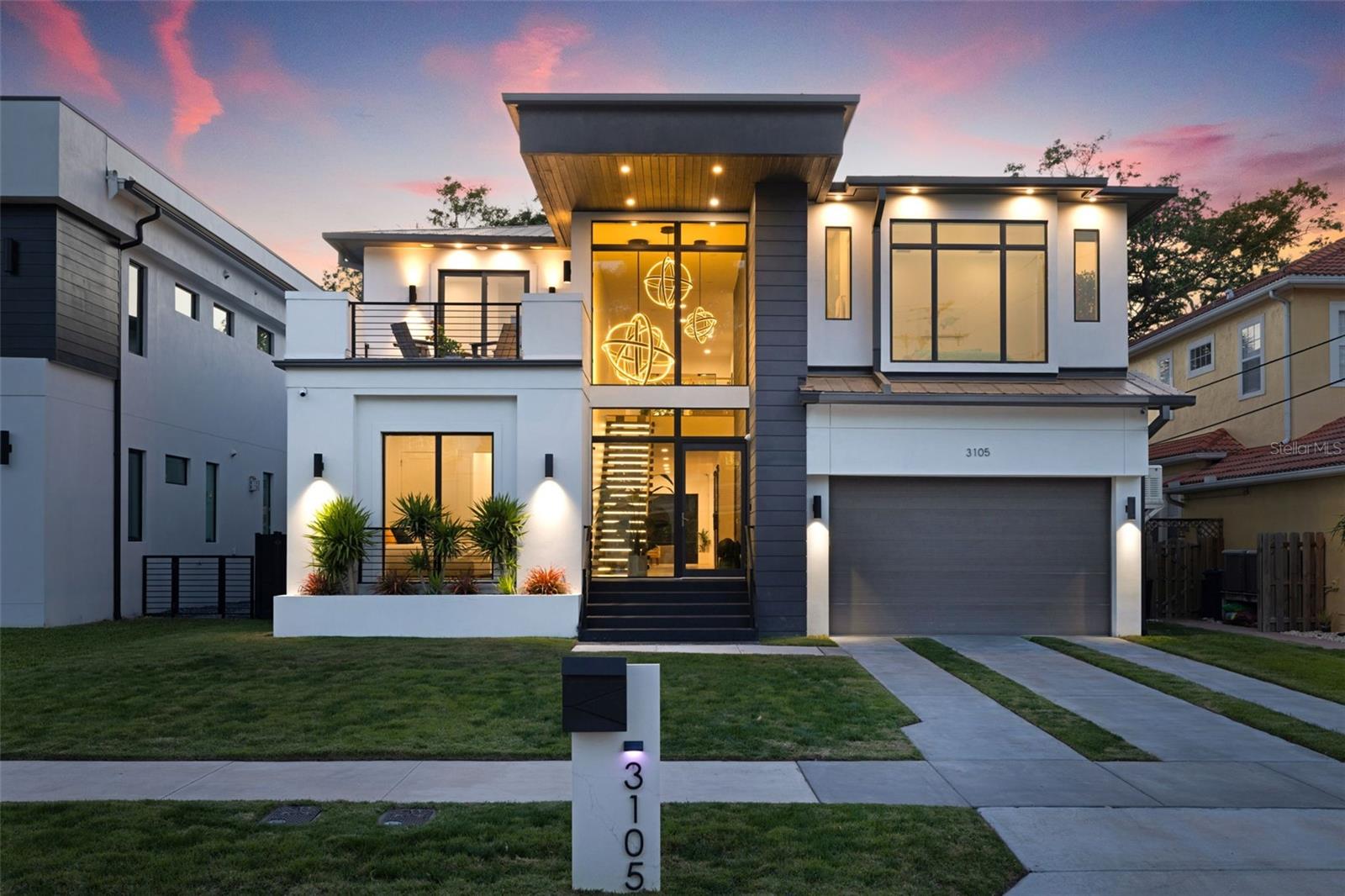 This custom-built block home, completed in 2021 by Legion Construction, epitomizes modern luxury & the best of Florida living. Situated in the highly coveted neighborhood of Sunset Park, this FURNISHED, MOVE IN READY - home boasts 6 bedrooms, 6.5 baths, office, & game/theater room, gym. With over 5,600 sq ft of thoughtfully crafted living space, every detail showcases sophistication & functionality. Upon entering the house you will find dramatic double height ceilings with LED globe lighting & a beautiful lit up floating staircase. Step inside to an open-concept floor plan adorned with high-end finishes throughout. Centered around a chef’s kitchen designed by Allikriste Custom Cabinetry, this home is the perfect place to host your diner parties. Outfitted with top-tier appliances, a temperature controlled 450-bottle wine cellar, & a seamless flow into the main living space & dining room. The screened in lanai & accordion doors allow for effortless indoor/outdoor entertaining. Downstairs you will also find an office, half bath, 2 bedrooms, & a full bath split between them both. The outdoor oasis is an absolute show stopper! Outside you will find an “invisible” screened in covered lanai, pool bath, & outdoor kitchen equipped with Blaze Teppanyaki Grill, Ooni Pizza Oven, & 5 Burner Blaze Grill. As you step off the lanai into the yard you will find high quality K9 XeriGrassturf, resort-style pool & spa with dual heaters, & fire burners that you can control from your app! Take the stairs or the elevator up to the second floor where you will find a secondary living area & 3 additional guest bedrooms, 4 bathrooms, balcony, the primary bedroom, gym, laundry, & a game/theater room. The primary bedroom features a dry bar with built-in mini fridge, dual closets with California closets & an in-wall watch safe with 12 automatic winders. The owner's bath features floor to ceiling tile, dual vanities, soaking tub, & a sizable shower with multiple shower heads. The gym is fully equipped with a sauna & peloton. The oversized, double height three-car garage is a standout feature allowing for lift capability to store more cars, it also offers a hidden fingerprint-access vault, overhead storage racks, & a custom-built mudroom w/ sports display cabinets. This home features a state-of-the-art, fully integrated Savant Smart Home System, delivering seamless automation throughout. Every room is equipped with at least one custom Savant smart panel, allowing effortless control over lighting, blinds, music, TVs, at the touch of a button. Recognized as one of the most advanced Savant systems in the country — it offers an unparalleled level of security, convenience, & peace of mind. Other features include: metal roof, hurricane impact windows/doors throughout, smart irrigation system, zoned AC units, smart thermostats, electric car charger, smart home integration, whole house powered 24w Generac Generator, full home alarm system with high quality security cameras throughout, reverse osmosis system, built-in water chiller/filter, surround sound system throughout the home, electric window shades throughout, smart AI energy monitoring system, 5GB/s fiber optic internet, 8 mounted TVs, Starlink roof mounted satellite, & so much more! Centrally located in prime South Tampa location with A rated school districts, & close proximity to all that Tampa has to offer including: Tampa International Airport, Hyde Park Village, plenty of shopping & dining options, beaches, & more!