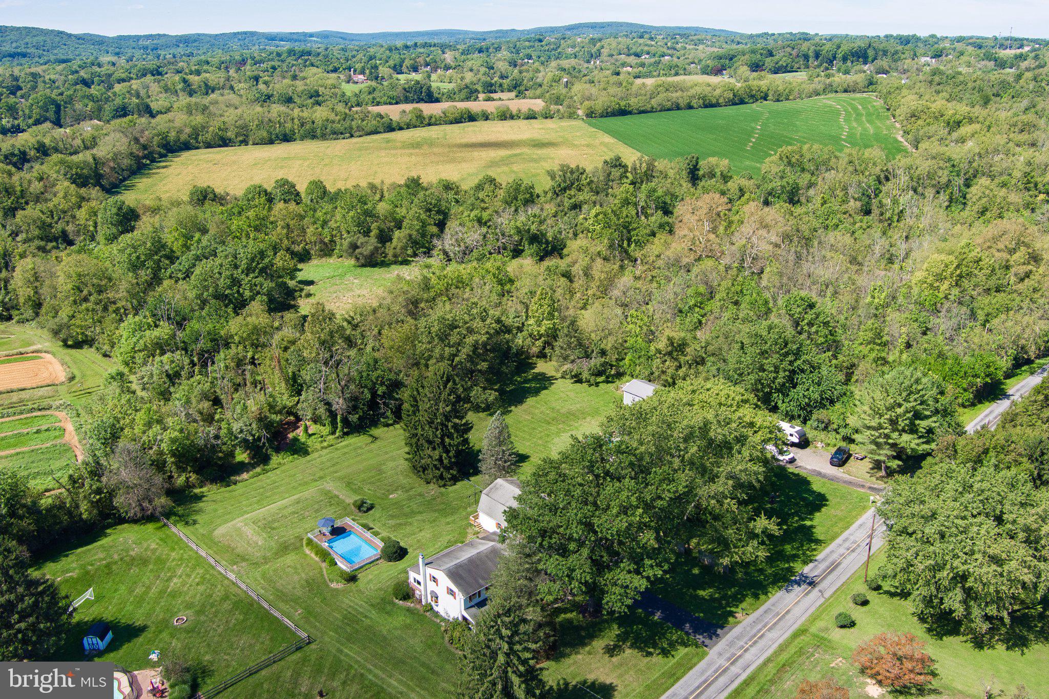 Spacious and sun-filled Colonial on a beautiful one acre parcel, with pool and oversized, lofted garage,  provides every space you'll ever need to enjoy a gracious indoor / outdoor lifestyle ! Optimally located just minutes from vibrant downtown Phoenixville, Kimberton Village, the Kimberton Waldorf School and Owen J. Roberts schools, this East Vincent property backs to woods and acres of Act 319 protected farmland, creating an ideal combination of peaceful country living with proximate shopping, cultural opportunities and schools.  Take the pathway to the  covered front porch entrance, complete with porch swing, into the entry hallway that connects the main level rooms with a lovely circular flow, starting with the formal living room.  This generous space features a beautiful bay window and opens to the dedicated dining room, also illuminated by a bay window, with hardwood floors throughout.   The adjacent kitchen, with oak cabinetry, Corian counters and breakfast bar, and stainless appliances, is wide open to the glorious sunroom with skylights, vaulted ceiling and oversized windows that welcome the sunlight, frame the back yard views and showcase amazing sunsets all year long!  The centrally located kitchen is also open to the  family room, with cozy wood stove and french door egress to the covered rear patio and yard and garage spaces beyond.  A door separates the family room from the convenient main level laundry room, which then connects to the in-law en suite with dedicated entrance; this space could also be well utilized as a fabulous tax-deductible home office, complete with attached full bathroom that can also be accessed from the family room.... The upper level of the home features four well-sized bedrooms, all with hardwood floors, including the primary en suite - both the primary en suite bath and hall bath have been fully updated! .... The basement level  offers even more space for fun with family and friends, along with pantry storage.....Outside, find plenty of sunny spots for gardening, along with a low-maintenance above ground pool wrapped by a Cumru hardwood deck.  The detached garage is oversized for two cars, with plenty of room for yard and garden storage and workshop area, and includes a Charge Point electric vehicle charging station!  Need even more space ?  Take the new exterior stairs to the 31' X 20' loft space above the garage, just waiting to be finished to suit your needs - home gym, workshop, art studio, playroom, it's all possible!  This awesome property will connect you with nature, while also providing convenient access to the region's major regional thoroughfares and Paoli's train lines to Philadelphia, NYC and DC !  Come see all this wonderful property has to offer!