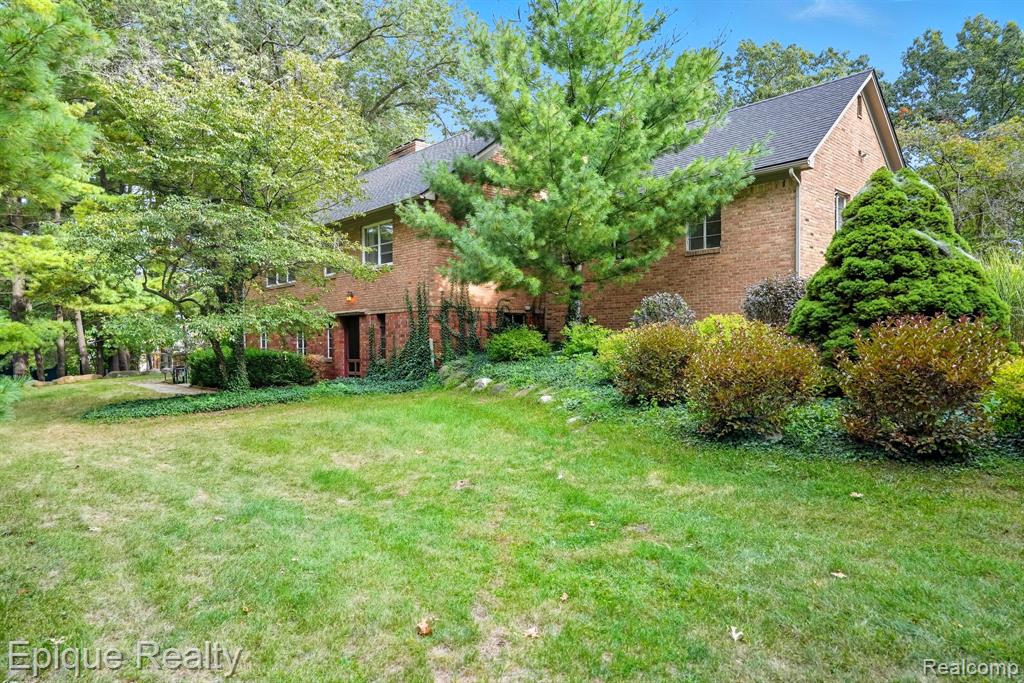 Weekend Showings Only.  Incredible opportunity to own an amazing home in Howell filled with history & unique features. Home comes with an ADDITIONAL  1/2 acre side lot ( 50 x 271)!  New ROOF, New BOILER and New ELECTRIC PANEL.  The main floor has an eat-in kitchen & an incredible dining room with exposed brick & wood beams – a great gathering place. Also on the main floor is the living room w/fireplace, 2 full bathrooms & 3 bedrooms (including the primary suite). Brand new roof, new appliances, new boiler!  Lower level has a large office w/fireplace (this room would also make a great living room/den), half bath, bonus room (currently exercise room). The 2nd floor has 2 large bedrooms w/hardwood flooring. Two car attached garage. Large spacious lot w/mature, towering trees. Bonus room has a separate driveway & entrance. The layout & zoning allows for many possibilities for a home based business if desired. B-2 zoning allows for many potential uses. Agents please read showing instructions.