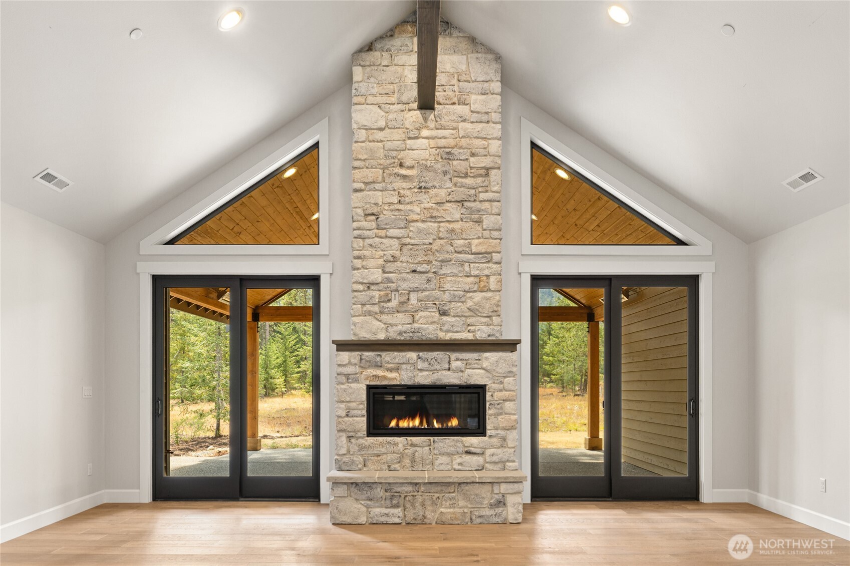 Beautiful fireplace with stone, hearth and mantel.