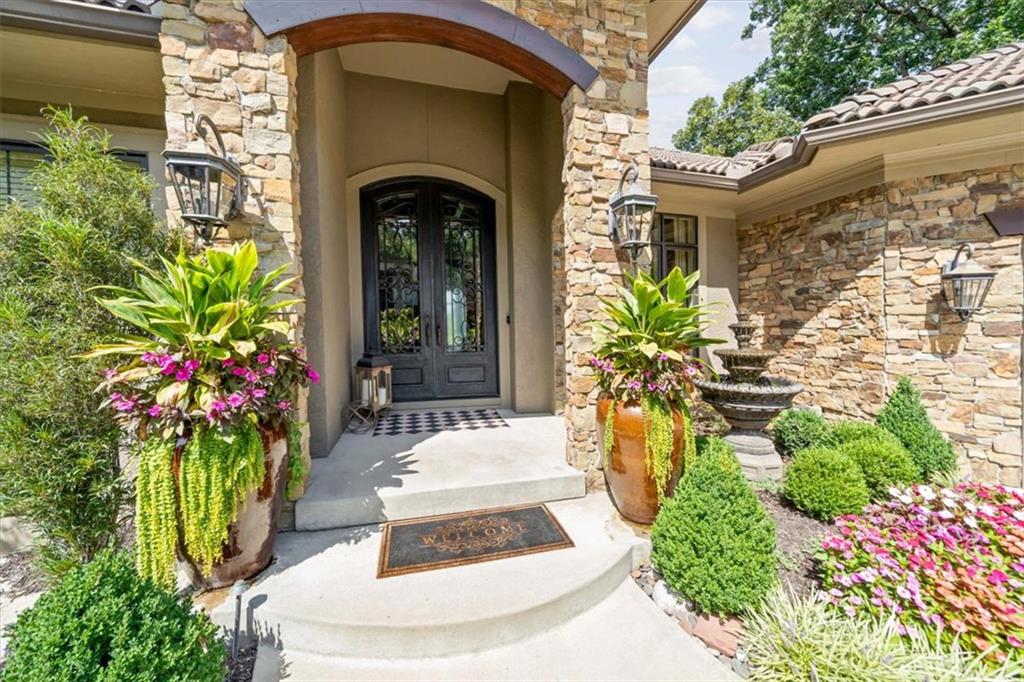 Reverse 1.5 Koehler custom build with elevated panoramic golf views overlooking the 15th green and premium privacy in coveted Loch Lloyd! You’ll feel like you’re on an indefinite vacation the moment you step out to the covered lanai with built-in grill and fireplace. Retreat downstairs to a gorgeous paver patio, fire pit, and extensive manicured landscaping surrounding the gunite pool.The spacious primary suite features beautiful golf course and pool views and leads to a luxurious bath, dedicated primary laundry room, and large closet with island. Entertain effortlessly in the open-concept floor plan featuring a generously sized living room with gas fireplace and chef’s kitchen with a large island, ample seating, and breakfast area. Doors from the kitchen lead to the covered lanai with fireplace, built-in grill, and low-maintenance composite decking. The second bedroom on the main level has been converted into a lovely den with convenient access to the lanai.The perfectly sized lower level offers two en-suite bedrooms, a second laundry room, spacious living area with fireplace, and wonderful bar with seating. The oversized three-car garage accommodates three vehicles plus a golf cart. The owners have spared no expense with recent pool resurfacing, a newer roof, and updated mechanicals. Walking distance to the community dog park, lake, and trails, combined with exceptional neighborhood amenities and security, makes this an ideal opportunity to enjoy the coveted Loch Lloyd lifestyle.