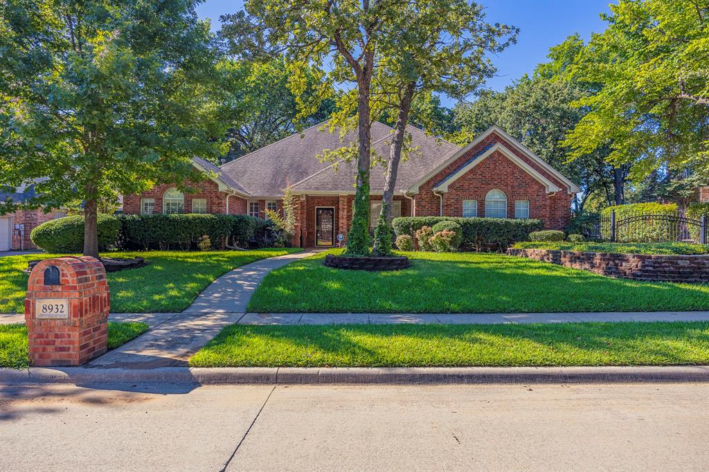 Have you been waiting for a new listing in Thornbridge of N Richland Hills? Here it is! Beautiful 4-bedroom 3 full bath home in wonderful neighborhood.
When you drive up you are sure to notice the established yard with tall trees and welcoming front porch. This property is a single-story home that is hard to come by in this subdivision. Behind the automatic iron gate, you'll find an oversized driveway and a 4-car garage! A nice feature of this property is the bedrooms are split 3 ways making it nice for guest and family alike.  Property has a new AC unit replace in last 5 years, outdoor decorative lighting, sprinkler system with rain gauge, loads of storage in garage and attic, and new flooring throughout living areas. Neighborhood has beautiful park, walking trails and friendly neighbors! Come take a look and see if this is your next place to call home!
