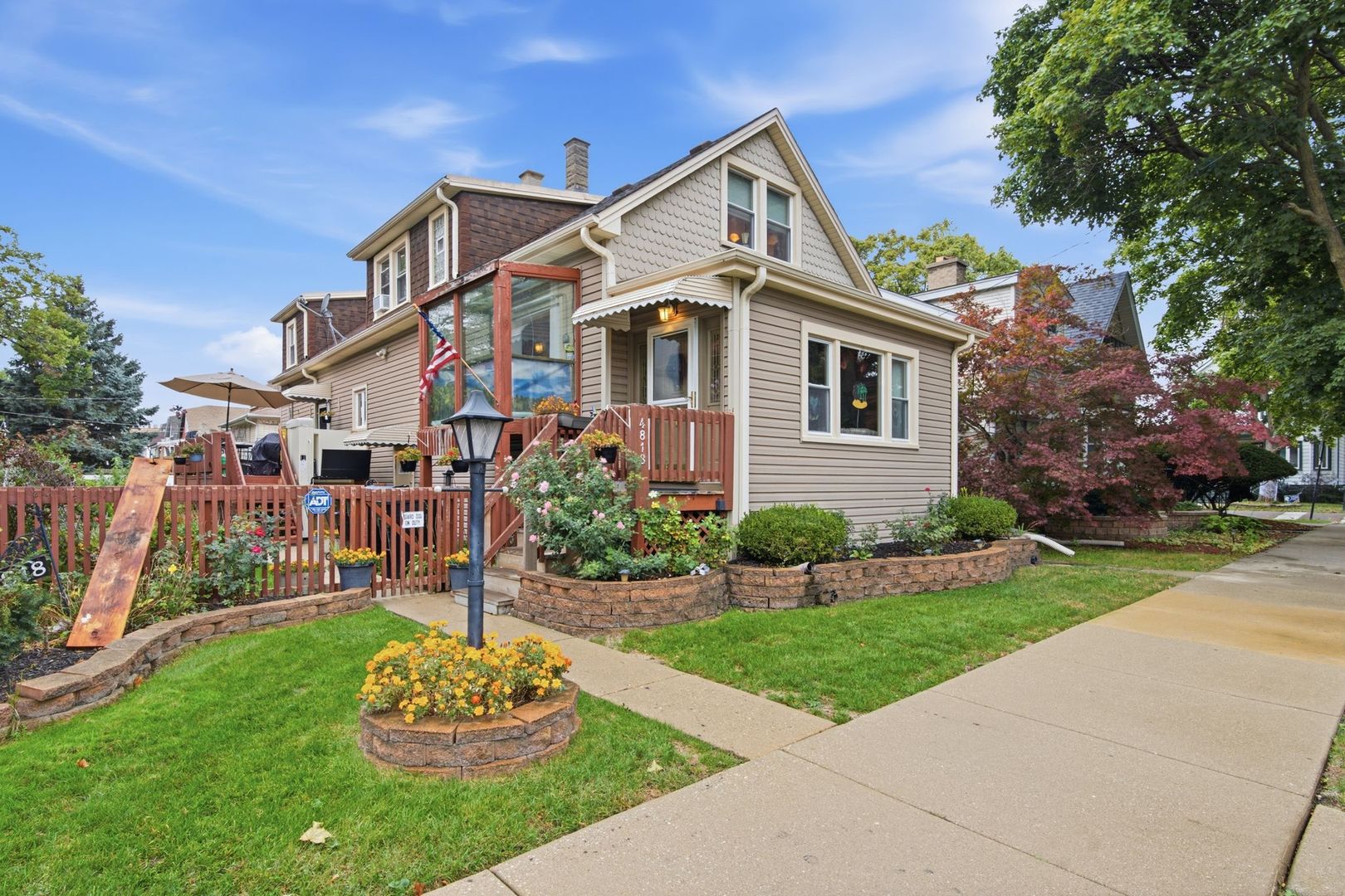 Welcome to 4818 N Menard, a 4 bedroom, 3 bath home on three levels in the heart of Jefferson Park, one of the Northwest Side's most convenient and welcoming neighborhoods. Set on a rare double lot, the property offers extra space you can actually use: a deck and big backyard made for weekend barbecues, with room for kids and pets to play, plus a roomy shed for additional storage. Inside, the traditional layout features a front sitting area, living room, and separate dining room, along with a spacious kitchen and a wood-paneled family room for extra gathering space. Three bedrooms upstairs have character, with sloped ceilings and distinct layouts. The finished basement offers additional living space, with its own kitchen, bedroom, bath, and separate entrance, giving the home two kitchens and a setup that's ready to work as an in-law suite, guest quarters, or space for extended family. The Jefferson Park transit center (Blue Line and Metra) and the expressway are close by, along with local restaurants, shops, and parks. Ready for your personal touch, this is a great place to settle in and grow.