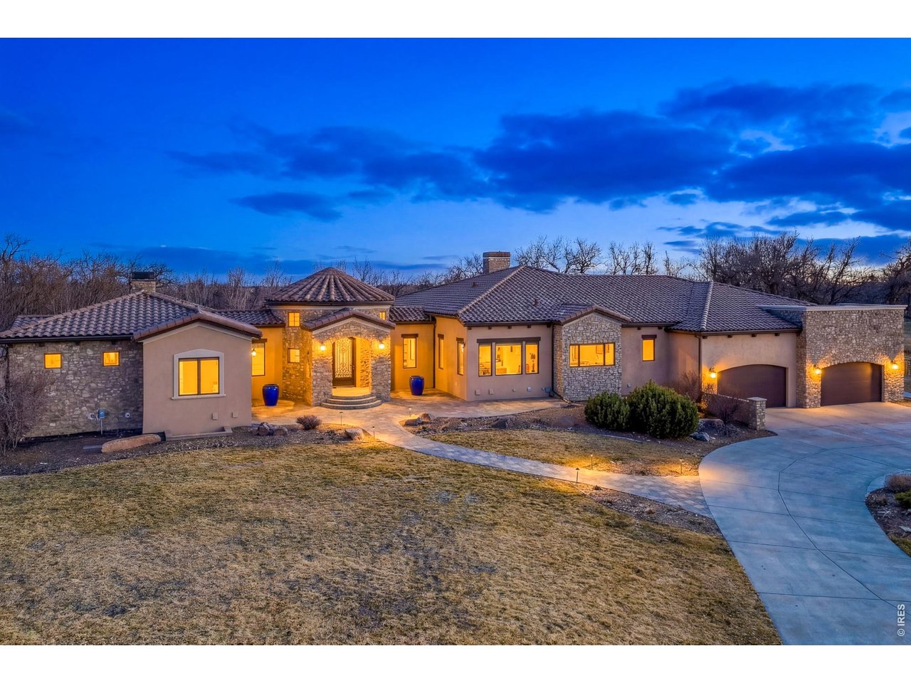 Set on 3.56 breathtaking acres with panoramic mountain views to the west and serene water views to the east, this extraordinary estate offers a rare combination of refined luxury, thoughtful design, and exceptional privacy. With the seller ready to make a move, this exceptional property presents a compelling opportunity for those seeking an estate of this caliber. A grand entrance welcomes you into an impressive interior where soaring ceilings, elegant finishes, and expansive windows beautifully frame the surrounding landscape. At the heart of the home, the gourmet chef's kitchen features premium Thermador appliances, an oversized island, and a spacious walk-in pantry, flowing seamlessly into the inviting living room anchored by a striking statement fireplace. Step onto the expansive deck directly off the living room to enjoy sweeping mountain vistas-an ideal setting for quiet mornings or memorable gatherings. Designed with multigenerational living and entertaining in mind, the main level offers two luxurious primary suites. One serves as a private retreat with its own sitting room and separate laundry area, making it exceptionally well suited for a mother-in-law suite, extended-stay guests, or multigenerational living. A richly appointed office with custom built-in shelving provides an inspiring workspace complemented by spectacular mountain views. The sweeping staircase leads to a lower level designed for both comfort and entertainment. Four generously sized bedrooms include three with private en-suite baths, while a spacious recreation room provides plenty of room to gather. A private theater, wet bar, workout room, wine cellar, and secure built-in safe area in basement. A four-car attached garage and an additional three-car detached garage for all the car lovers. The fenced backyard offers privacy, space to roam, and a peaceful connection to the surrounding landscape. A truly remarkable property where luxury meets lifestyle at every turn.