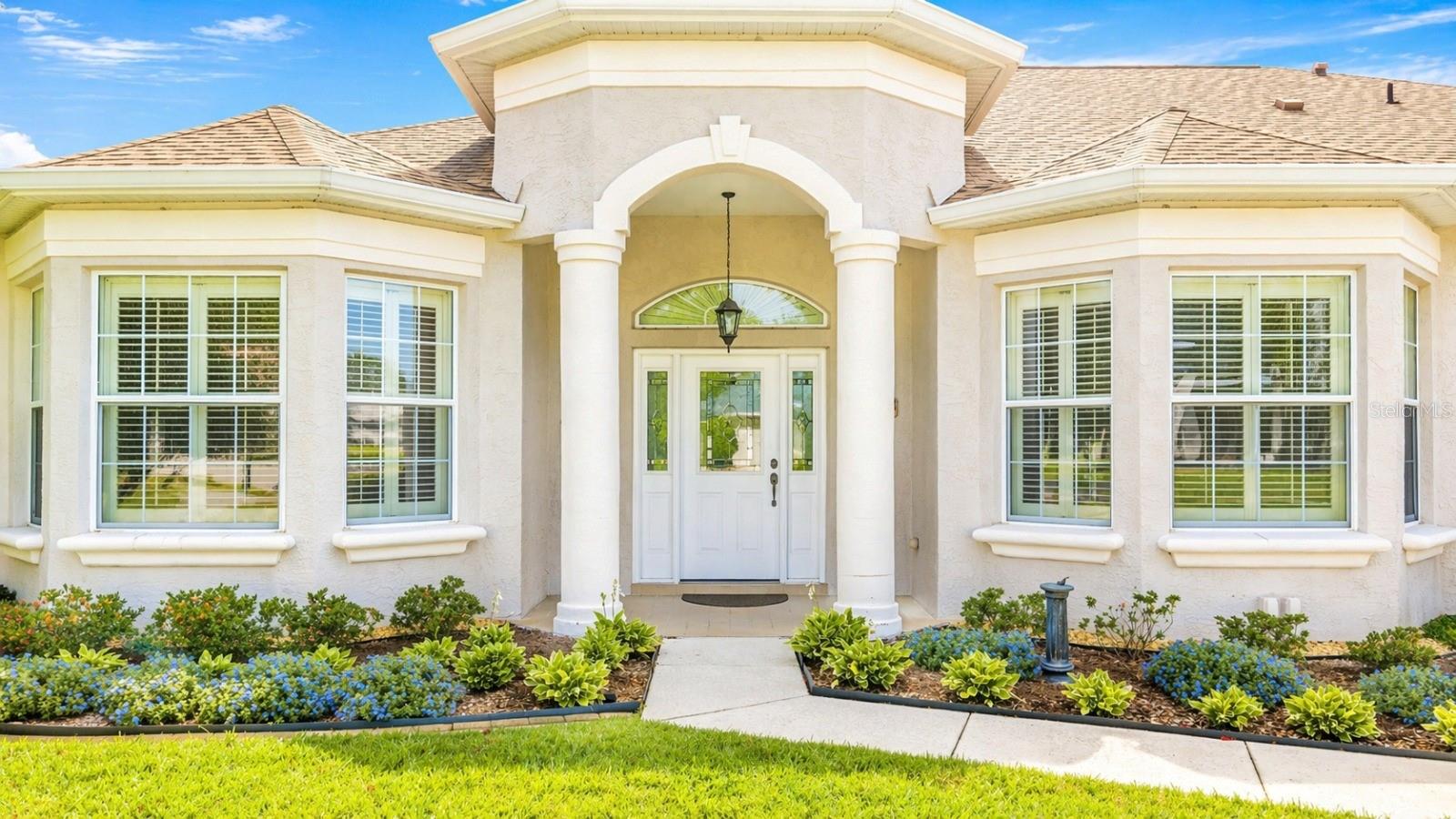 Welcome to your private retreat right on the golf course, where luxury, comfort, and breathtaking views come together seamlessly.This beautifully designed home offers 3 bedrooms, 2.5 bathrooms, a dedicated office, den, formal living room, and a spacious family room—providing flexibility for both everyday living and entertaining. In addition to the two-car garage, a separate golf cart garage adds the perfect touch for golf course living and extra storage.Step through the elegant stained glass front door into a grand entryway that opens to a refined formal living space, showcasing coffered tray ceilings, crown molding, and soaring ceilings throughout. A cozy fireplace anchors the space, while the dining area is ideal for hosting, highlighted by detailed trim work and upscale finishes. Plantation shutters and custom window treatments enhance both style and functionality.The primary suite is a peaceful retreat featuring two walk-in closets and energy-efficient windows and doors for year-round comfort. The thoughtfully designed floor plan offers privacy for guest bedrooms, making it ideal for visitors or multi-generational living.Step outside and experience resort-style living at its finest. The enclosed lanai with glass windows creates a true indoor-outdoor experience, complete with a summer kitchen featuring a built-in grill and sink—perfectly positioned in the screened-in porch just off the pool area. The backyard is your personal oasis with a sparkling pool, relaxing hot tub, ambient lighting, and stunning golf course views that provide both beauty and tranquility.Whether you're entertaining guests or enjoying a quiet evening overlooking the fairway, this home delivers the lifestyle buyers are searching for.Don’t miss this rare opportunity to own a golf course property with exceptional features—schedule your showing or submit your offer today!