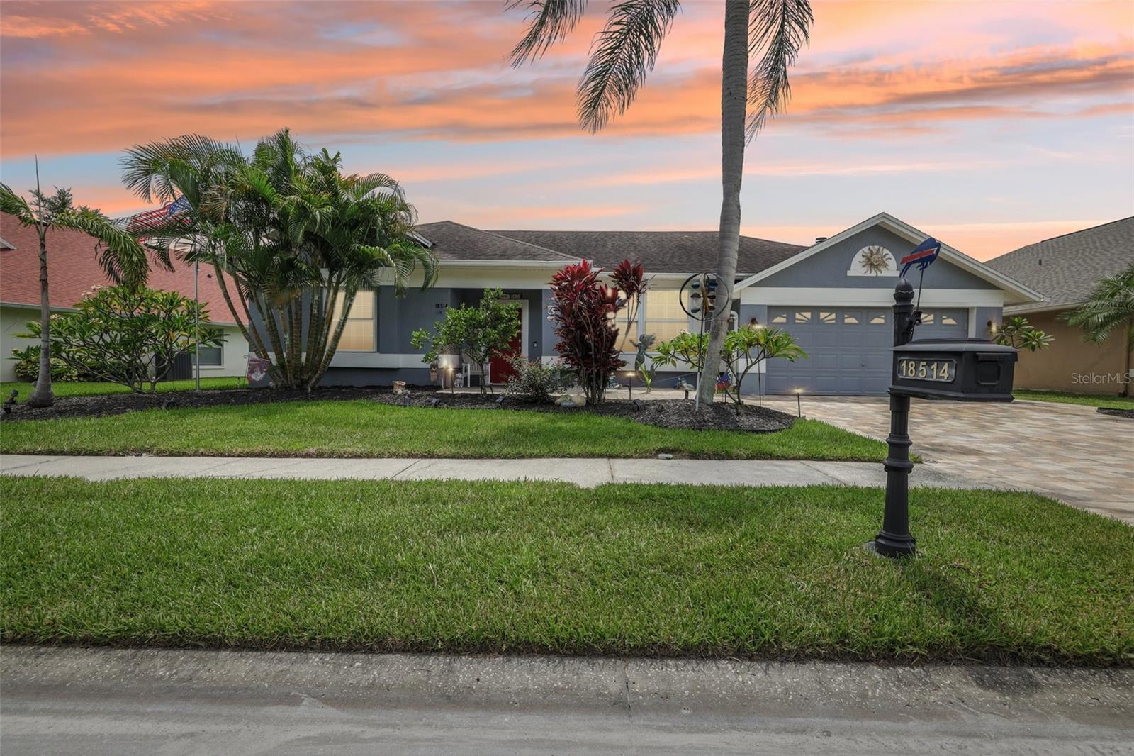 Welcome to this truly breathtaking contemporary-style home, perfectly nestled in the prestigious neighborhood of Calusa Trace. Outfitted with a whole home generator, you can enjoy complete peace of mind knowing you’ll have uninterrupted comfort even during power outages. This residence offers four spacious bedrooms, two beautifully updated bathrooms, a two-car garage, a sprawling lanai, and a sparkling pool, all within 2,326 square feet of luxurious living space. Designed with a desirable split floor plan, this home seamlessly blends comfort, functionality, and elegance. Step inside to discover stunning wood-look ceramic tile flooring in the main living areas, the primary bedroom, and bedrooms two and three, creating a cohesive and stylish foundation throughout the home. The fourth bedroom is finished with high-quality engineered hardwood flooring, adding a touch of warmth and character. The interior is complemented by walls finished in today’s most stylish and welcoming paint tones. The kitchen is a showstopper, featuring sleek cabinetry, gleaming granite countertops, high-end stainless steel appliances, recessed lighting, a breakfast bar, a matching bar and hutch, and a walk-in pantry for added storage and style. The open-concept design connects effortlessly to the expansive family room, where soaring ceilings and a cozy fireplace with a newly refinished mantle create the perfect gathering space. The bright and airy primary suite is a serene retreat with tall ceilings, private access to the pool and patio, and a spa-like en-suite bath with dual vanities, a soaking tub, an oversized shower, and two spacious walk-in closets. Each additional bedroom is generously sized, offering ample storage and flexibility for your lifestyle. Step outside into your own private oasis. The screened-in lanai leads to a beautifully paved patio surrounded by lush artificial turf and eye-catching landscaping, including gorgeous flowering plumerias that add vibrant color and charm. The paver driveway enhances the home’s curb appeal and adds a refined touch to the exterior. Cellular shades provide extra comfort and shade in the outdoor living area, making it ideal for both entertaining and relaxing. Thoughtfully upgraded throughout, this home includes a complete re-pipe in 2020 and a new HVAC system installed in October 2023 with a 10-year transferable warranty. The ductwork has been resealed for enhanced efficiency, and a whole home water filtration system ensures clean, refreshing water throughout. The Ecoprobiotic EPS365 system is integrated into the HVAC to naturally reduce allergens, pollutants, and bacteria, helping to maintain a healthier indoor environment and cleaner air ducts. Additional features include solar attic fans, added insulation, hurricane-rated sliding doors and front and side windows, low-voltage exterior lighting, newer indoor and outdoor fans, updated appliances, and a new pool pump with a saltwater system. Situated within the boundaries of highly acclaimed schools (Schwarzkopf Elementary, Martinez Middle, and Steinbrenner High). Not to mention just minutes from premier shopping, dining, medical centers, and major highways, this home offers an unmatched blend of luxury, location, and lifestyle. Schedule your private showing today and experience the exceptional quality and comfort this remarkable property has to offer.