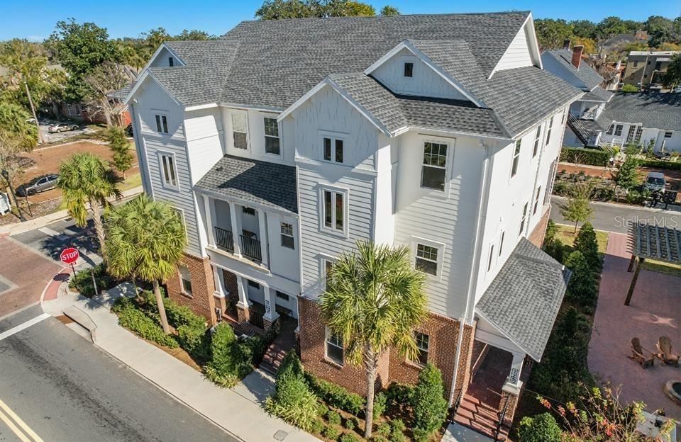 One or more photo(s) has been virtually staged. Experience vibrant downtown living in this beautifully constructed townhome located just steps from Ocala's historic square, boutique shopping, and top-rated restaurants. This 3-bedroom, 3.5-bathroom residence offers the perfect blend of modern style, comfort, and convenience. Step inside to an open-concept living, dining, and kitchen space adorned with custom modern finishes, sleek cabinetry, and designer lighting. The gourmet kitchen is ideal for entertaining, flowing seamlessly into the spacious living area and out to a private balcony with stunning views of downtown. Each of the three levels has been thoughtfully designed, featuring a luxurious primary suite complete with a spa-inspired bathroom and an oversized walk-in closet. Two additional en-suite bedrooms provide comfort and privacy for guests or family members. Enjoy the convenience of a 2-car garage, low-maintenance living with HOA-managed landscaping, and the security of a gated community. Relax with neighbors at the community’s gas firepit or take a short stroll to downtown Ocala. This is the ideal home for those seeking upscale, walkable city living with the peace of mind that comes with new construction.