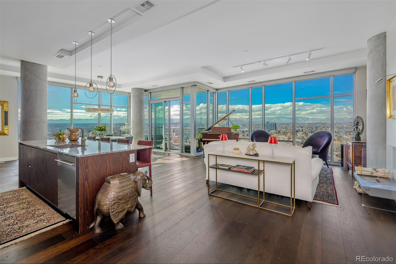 Come fall in love with the quiet serenity of this gorgeous and exclusive retreat high above Denver. Tucked into a private, sunny corner on the highest floor, your backdrop is breathtaking, unobstructed mountain and lake views through lavish floor to ceiling windows. Watch the clouds roll by and enjoy surreal sunsets from your living areas and private balcony. Create your personal haven in this open, light-filled, and efficient floorplan with 10-foot high ceilings, spacious rooms, and many perfect places for art. The upgraded luxury finishes include custom hardwood and marble flooring, custom built-ins and closets, a custom bamboo/ceramic wall treatment and more. Cook and entertain with delight in this expansive chef’s kitchen with high end stainless-steel Sub Zero, Asko, and Wolf appliances, ItalKraft cabinetry, and a massive island. Two wonderful roomy ensuite bedrooms, including a serene Primary Suite with five-piece, spa-like bath, and a spacious Guest Suite, both with motorized black-out blinds and customized closets. Read, watch movies, and relax in the cozy custom Den, or utilize the space as an Office or Library. This one of a kind building was specifically designed to support a healthy lifestyle, and is Colorado’s only Gold certified WELL building. First class 24-hour front desk attendant, year-round heated 70 foot lap pool and hot tub, organic urban farm, state-of-the-art fitness center, yoga studio, pet spa, huge resident’s lounge and kitchen, outdoor kitchen with grills, guest suite, sports/bike workshop, craft room, and more! The amenities and available activities are truly unparalleled. You have your choice of convenient restaurants including Cholon and Gusto Italian right outside. Across the street, enjoy gorgeous Sloans Lake Park. Check out a paddleboard, bike, or kayak, take a walk or run, or take the kiddos to the state of the art playground! Perfect location, minutes to Downtown, the Highlands, and the mountains. Perfection!