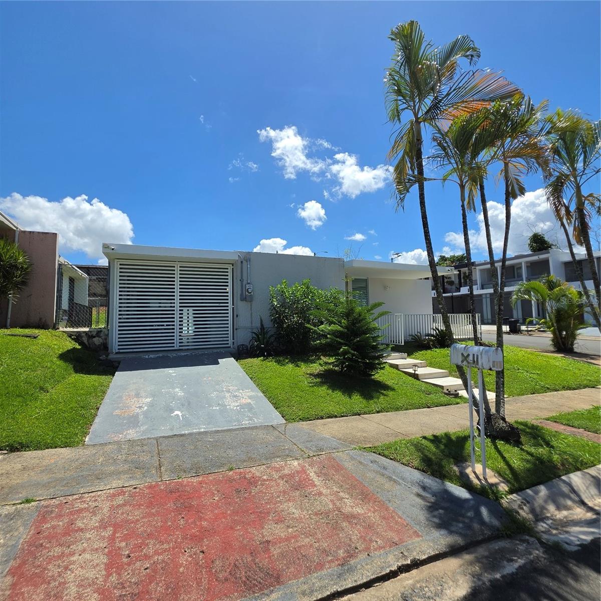 Exceptional opportunity to own a move-in ready corner home in the sought-after gated community of Park Garden in San Juan. This well-maintained one-level residence offers a comfortable and functional layout featuring a bright living room, dining area, kitchen, spacious family room, balcony, and covered garage. The home includes 3 bedrooms and 2 full bathrooms, plus a private backyard ideal for entertaining or relaxing.The corner location allows for abundant natural light, excellent cross ventilation, and added privacy. Property is in excellent condition and ready for its new owners. Furniture and appliances are negotiable, offering a convenient transition for the buyer.Centrally located just minutes from shopping centers, restaurants, schools, hospitals, and major expressways. Don't miss this great opportunity to own in one of San Juan’s most convenient locations.
