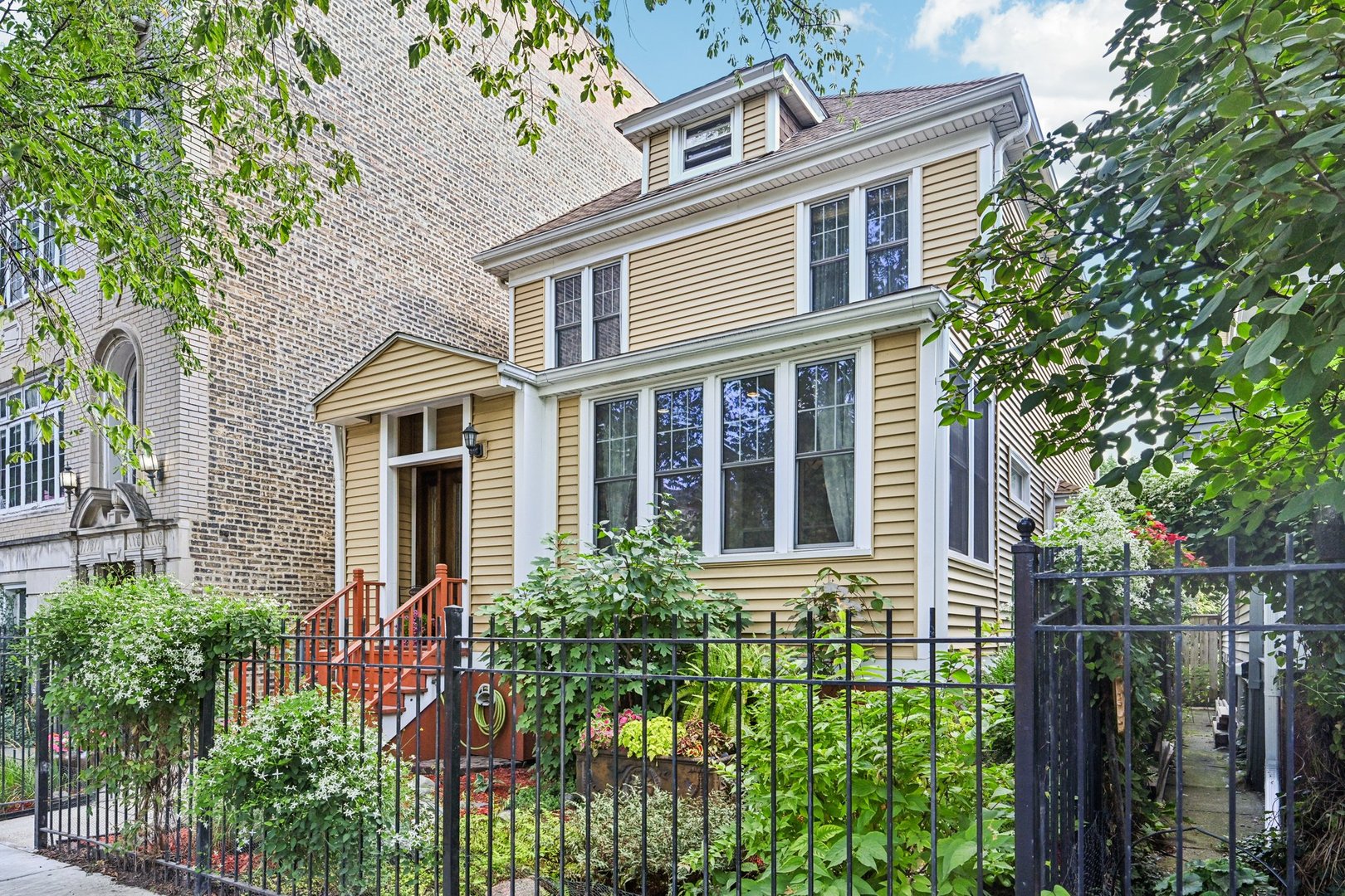 Embrace historic character with modern-day convenience in this beautifully preserved home nestled in the heart of Ravenswood. Four levels of living space, set on an extra large lot, this residence showcases four bedrooms and two-and-a-half baths thoughtfully arranged for both family living and entertaining. Step inside and you'll be greeted by sun-filled living spaces, hardwood floors, and classic architectural details that create a warm, inviting atmosphere. The kitchen offers plenty of storage and prep space, perfect for entertaining or weeknight dinners. Upstairs, the bedrooms are generously sized. Great 4th bedroom in the attic space, filled with natural light from the skylights. The finished basement allows the opportunity to flex the space to your needs. Enjoy summer evenings relaxing or entertaining in your huge backyard with lush landscaping, large deck and a handsome pizza oven. Newer HVAC, roof and siding. Two car garage with a side concrete pad allowing for a 3rd parking spot. Located near everything that Ravenswood and Lincoln Square have to offer: Multiple Parks, tons of dining, cafes, breweries, and much more.