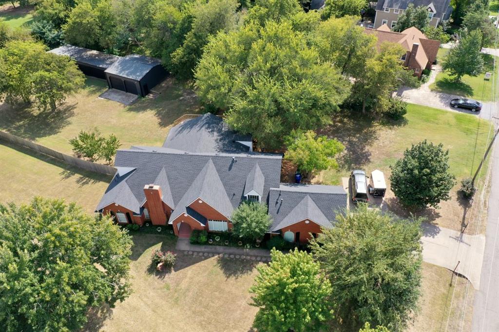 BEAUTIFULLY RENOVATED HOME NEAR OU CAMPUS-OVER 5000 SQFT!
DON'T MISS THIS SPACIOUS AND UPDATED HOME IN A SERENE, PARKLIKE SETTING NEAR THE UNIVERSITY OF OKLAHOMA. WITH 5015+ SQ FT TOTAL, THE PROPERTY INCLUDES A PRIVATE ENTRY BONUS ROOM 1419+ SQ FT WITH A FULL BATH AND KITCHENETTE-PERFECT AS A FOURTH BEDROOM, GUEST SUITE, OR RENTAL. 
THE MAIN HOME 3596+ SQFT, FEATURES A LARGE OPEN LIVING AREA WITH A FIREPLACE, SPLIT-BEDROOM LAYOUT, UPDATED SUNROOM WITH PANORAMIC DOORS, AND NEW 40X30 DECK. THE KITCHEN AREA INCLUDES A CUSTOM BUFFET WITH SOFT CLOSE CABINETS AND IS READY FOR YOUR FINISHING TOUCHES-WITH NEW FISHER AND PAYKEL APPLIANCES ALREADY PURCHASED AND INCLUDED.
ADDITIONAL HIGHLIGHTS:
TWO NEW HVAC UNITS (UPSTAIRS AND DOWNSTAIRS), NEWER ROOF, PAINT, AND CUSTOM WOODWORK. A 30X30 INSULATED WORKSHOP WITH AN INGERSOLL RAND INDUSTRIAL TWO STAGE AIR COMPRESSOR THAT WILL STAY "AS IS",  A  21 X 70 SIX CAR BAY WITH UPGRADED PAINT. NEW FENCING, LIGHTING, CEILING FANS, AND MORE.
A RARE OPPORTUNITY WITH SPACE, FLEXIBILITY, AND HIGH-END UPGRADES-PERFECT FOR FAMILIES, STUDENTS, OR INVESTORS.
SELLERS CURRENTLY RENT PARKING SPACES IN THEIR YARD FOR ALL OU HOME GAMES. 
SELLER WAS TOLD BY THE CITY PLANING DEPARTMENT THAT A SECOND HOME COULD BE BUILT ON THE PROPERTY WITH SOME STIPULATIONS. 
THE 2 ACRES INCLUDES THE CITY EASEMENTS. THE ACREAGE WITHOUT THE CITY EASEMENTS IS 1.31+.
BUYER TO VERIFY ALL INFORMATION.