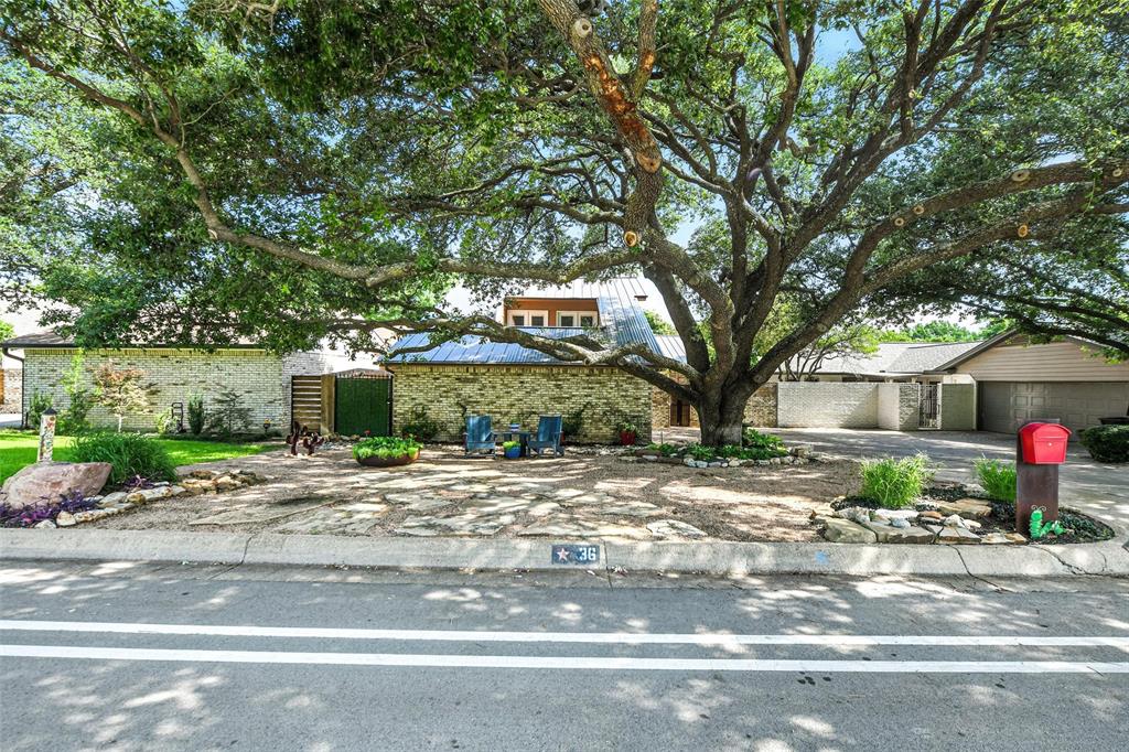 Welcome to 36 Legend Road — a fully updated garden home that perfectly blends timeless charm with modern, low-maintenance living in a great location near Waterside shopping. This 3 bedroom, 2.5 bath home offers over 2,200 square feet of beautifully refreshed space on a quiet, tree lined street just minutes from the coveted Trinity Trail system.
Every inch of this home has been thoughtfully renovated, from the metal roof, HVAC, and tankless water heater to the flooring, bathrooms, kitchen, and more. Step inside to waterproof luxury vinyl flooring, a spacious formal dining room, and an inviting living area ideal for everyday comfort or entertaining guests.
The kitchen features leathered granite countertops, stainless appliances, and generous cabinet storage. The primary suite offers a peaceful retreat with an updated en-suite bath and walk in closet, while two guest rooms upstairs each boast french doors that lead to a private second story deck.
Step outside to a resort style backyard with zero maintenance turf, a wrap-around putting green, tranquil water feature, and a brand new pergola.  The perfect blend of beauty and function!
Other highlights include a side entry garage and drought resistant landscaping. Ideally located near Benbrook Lake, Clear Fork, and top dining and retail. This home delivers turn key living in one of Fort Worth’s best kept secrets.