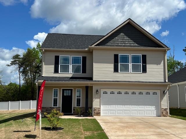 MOVE IN READY! The Heatherwood (Lot 15) offers a modern, open concept living area perfect for entertaining.  4 bedroom, 2.5 bath. Complete with the trademark chair rail, crown molding, and rope lighting.  12'x12'' covered back patio.   30-year architectural shingles, site-built construction, and a 10 year limited warranty are included to give you peace of mind.  Preferred Lender/Attorney Closing Costs Incentive Offered! *Virtual tour reflects same house plan, not exact house.