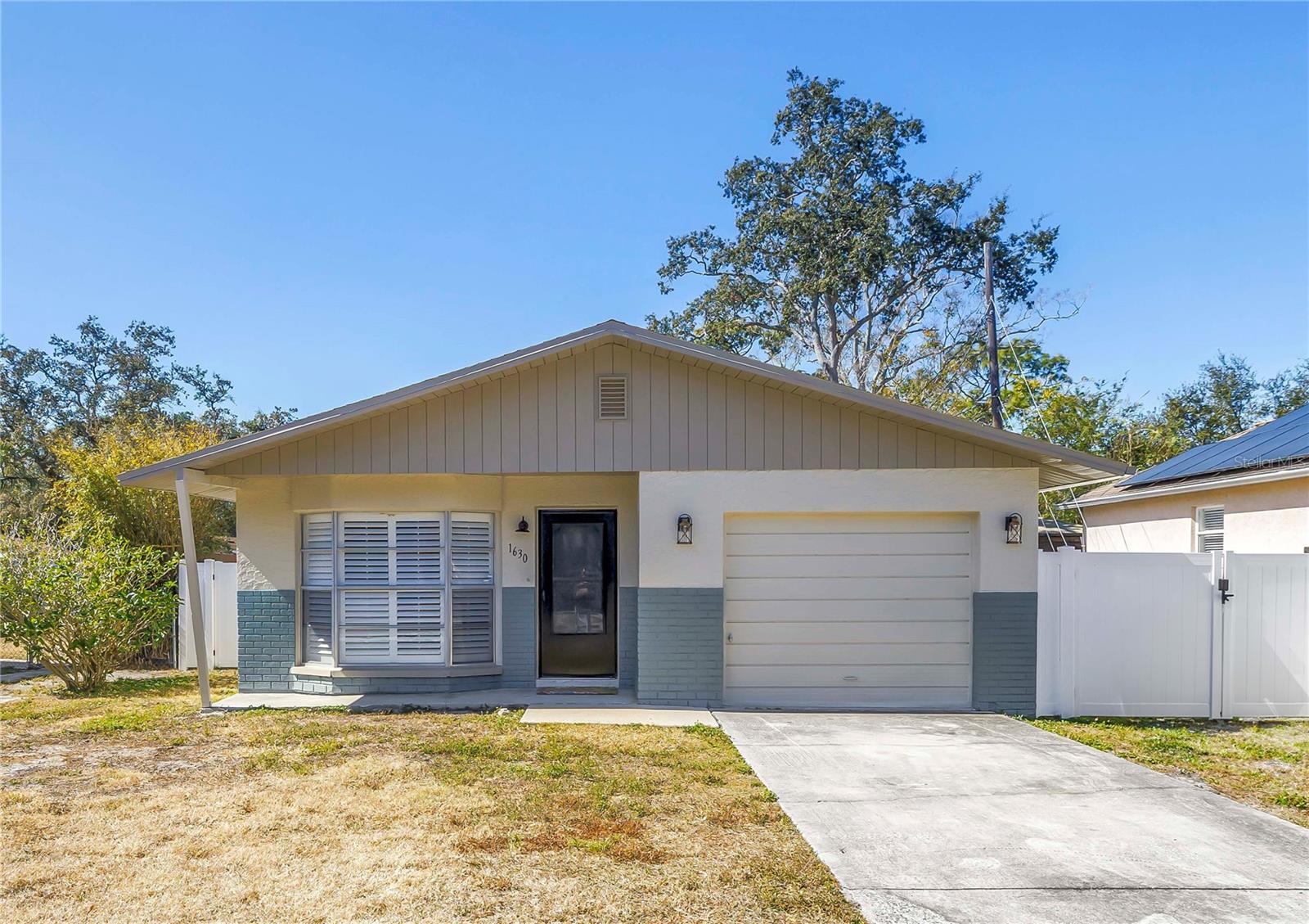 Charming Florida Bungalow situated on an oversized lot, this move-in ready home offers a well-designed floor plan with two bedrooms plus a bonus room and one full bathroom, all connected by cohesive tile flooring throughout. The inviting living room sits at the front of the home and is filled with natural light from a large bay window with custom plantation shutters.The spacious eat-in kitchen located just off the main living area includes a new LG oven and refrigerator while the laundry room to the right provides easy access to the oversized backyard. Two additional bedrooms are located at the rear of the home, each offering generous square footage, large closets, and excellent privacy. Additional hallway closets provide convenient storage.Recent updates add peace of mind and modern appeal, including a brand-new roof in 2024, new vinyl fencing 2024, and fresh interior and exterior paint. Along with the new kitchen appliances, the laundry room includes a new LG washer and dryer. The location is hard to beat—Gulf beaches are less than four miles away, with Taylor Park and the Southwest Recreation Complex both under a mile from the home. Dining, shopping, and local coffee houses are all just a short drive away, making this property as convenient as it is comfortable.A fantastic opportunity to enjoy Florida living with space, updates, and an ideal location.