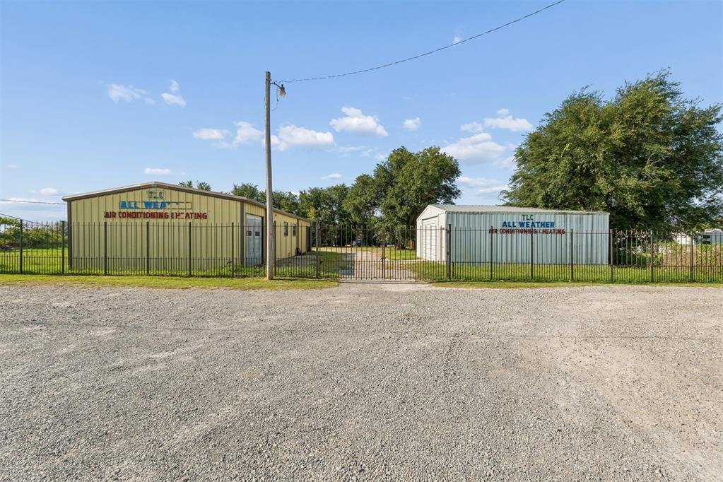 Gated Warehouse & Shop In NW OKC There are four buildings in this gated property located east of MacArthur and south of NW 10th St.Building 1 (Main Building)- approx. 556 sq. ft. of reception area, private office, mens and women's restrooms, and storage area. There are two bays in this building that have approx. 455 sq.ft. and 437 sq.ft.This building has heat & air conditioning.Building 2 white building - approx. 700 sq. ft. with electric and one bay door.Building 3 - red building - approx. 282 sq. ft. No utilities in this building.Water cutoff is on the south side of the building.Building 4 - is behind building 1 - approx. 310 sq. ft. No utilities in this building.