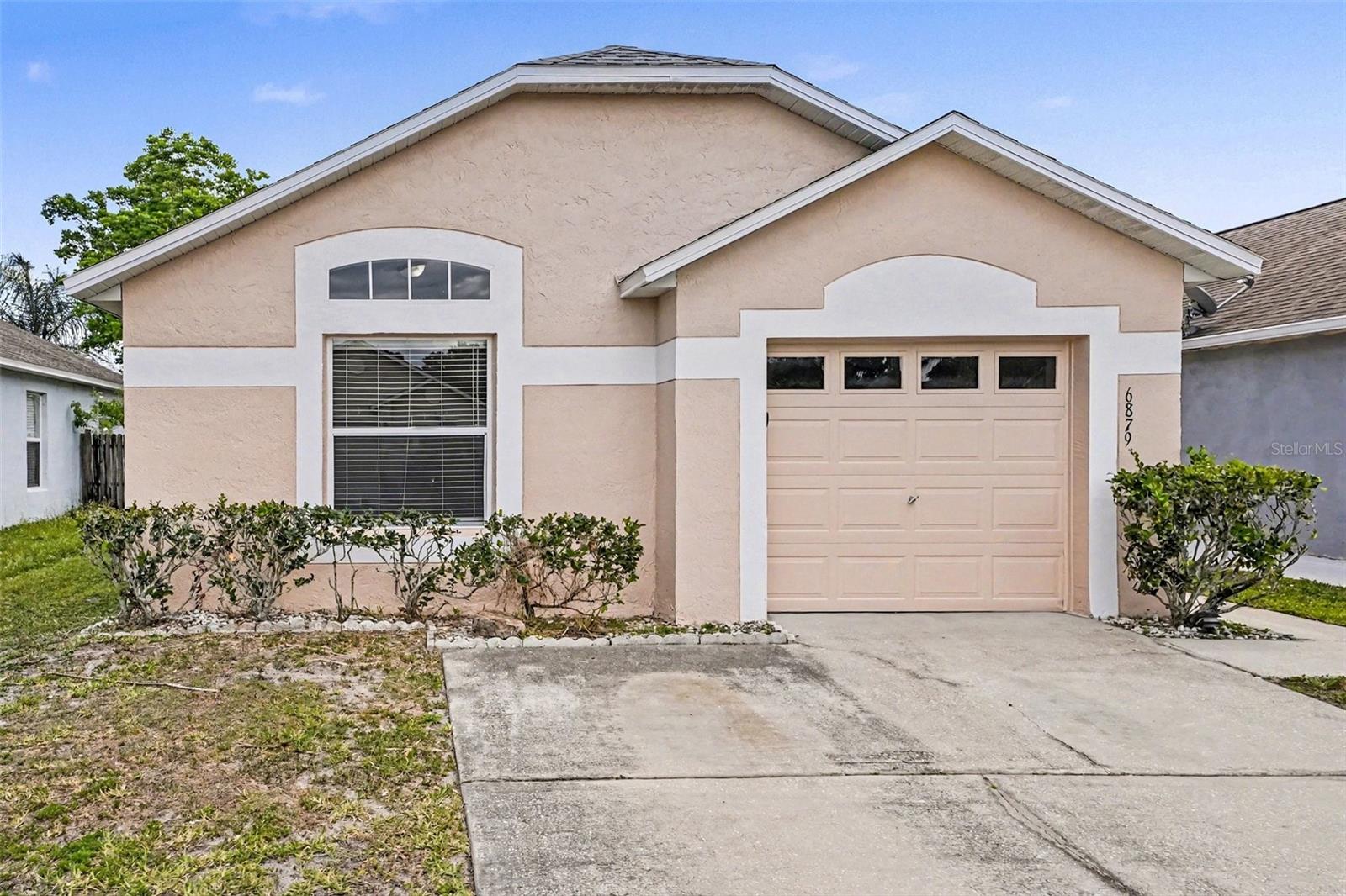 Welcome to 6879 Belmar Drive in Orlando—a charming 3-bedroom, 2-bath home offering 1,052 square feet of comfortable living space in a convenient and established neighborhood. Perfect for first-time buyers, downsizers, or investors, this property offers both value and opportunity.Step inside to a bright and functional layout with a welcoming living area filled with natural light. The kitchen features ample cabinetry, stainless steel appliances and solid surface counters. The primary bedroom includes an en-suite bath for added privacy, while two additional bedrooms provide flexibility for guests, family, or a home office.Enjoy outdoor living with a fenced in backyard—perfect for relaxing, entertaining, or creating your own personal retreat. Ideally located near major highways, shopping, dining, and just a short drive to Downtown Orlando, this home offers both convenience and accessibility.Whether you're looking for a primary residence or an income-producing property, this is an opportunity you don’t want to miss. Schedule your private showing today!