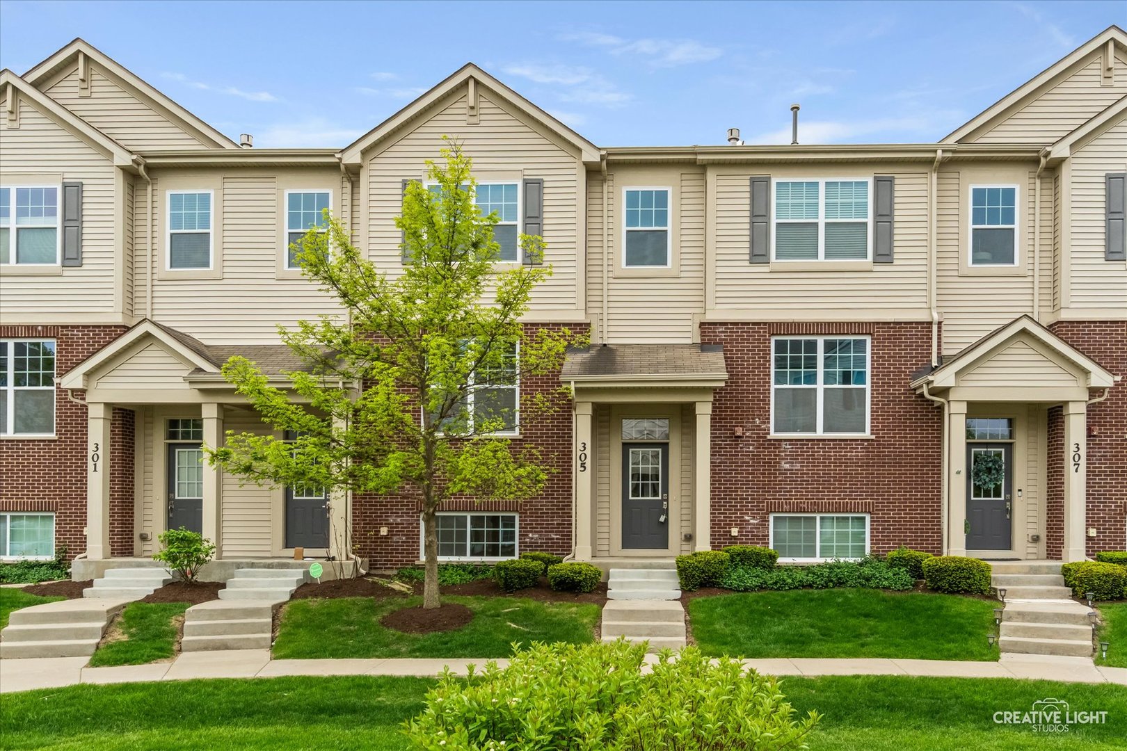 This gorgeous townhouse has everything you need and more! The main floor features an open layout with a bright eat-in kitchen complete with white cabinets, granite countertops, an island with breakfast bar, glass subway tile backsplash, and stainless steel appliances. The cozy family room with fireplace flows into the dining area, while a private office-also perfect as a third bedroom-and a convenient powder room make everyday living and entertaining easy.  Upstairs, you'll find two spacious bedrooms, each with its own en suite bath and walk-in closet. The primary suite stands out with a vaulted ceiling, an additional closet, and a private bath featuring dual sinks and a large vanity. The second-floor laundry room, located between the bedrooms, includes a washer, dryer, and extra cabinet storage for added convenience.  The lower level offers a flexible space ideal for a guest room, rec room, home gym, or hobby area. Additional features include hardwood floors, crown molding, a private deck, and a two-car attached garage.  The location is hard to beat! The front door opens to a quiet courtyard, and the library is less than a block away. You'll also enjoy quick access to the Metra station, Woodfield Mall, Kimball Hill Park, North Salk Park, and the Lexington Woods Trail-making shopping, commuting, dining, and outdoor recreation all close to home.