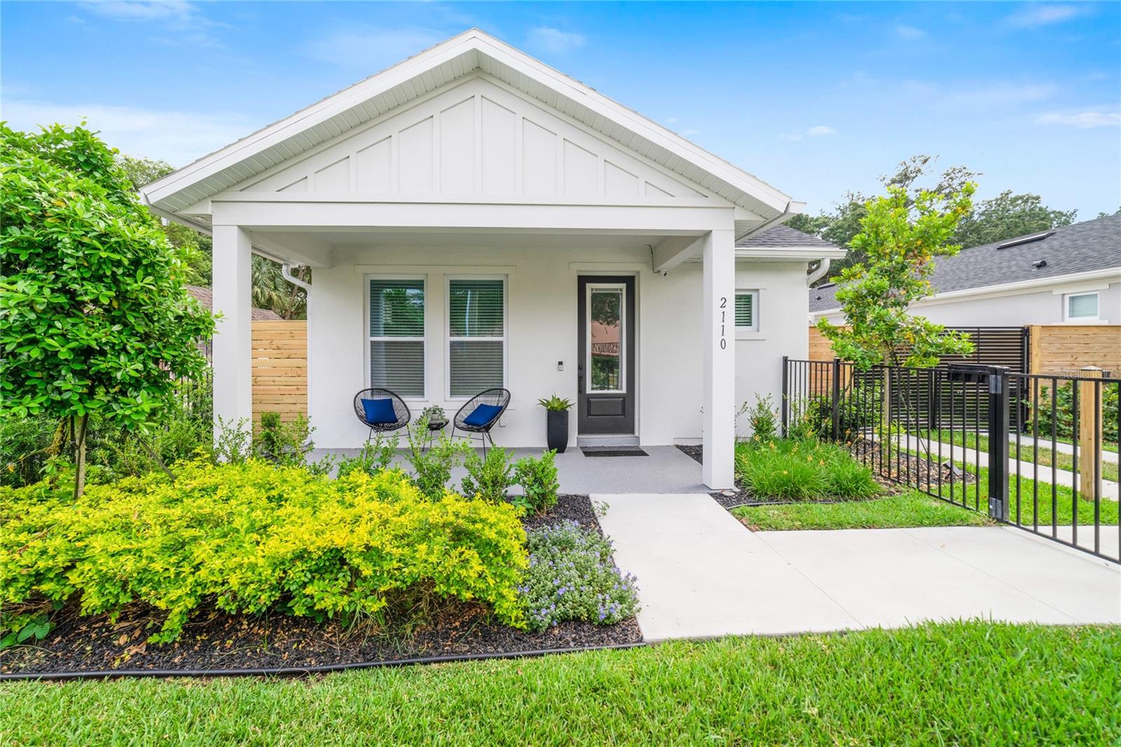 Welcome to 2110 & 2112 Hillcrest Street – Where Modern Comfort Meets Timeless Charm! Nestled in the heart of highly sought-after Milk District, this exceptional almost brand-new David Weekley home is more than just a place to live—it’s a lifestyle upgrade. With a detached, fully equipped mother-in-law suite and thoughtfully curated designer finishes, this property is a rare gem in Downtown Orlando. Step inside the main residence, offering 2 spacious bedrooms, 2 luxurious bathrooms, a private office, and approximately 1,450 sq ft of light-filled living space designed to inspire. Every inch of this home whispers quality and elegance—from the rich wide plank luxury vinyl floors that run underfoot to the dark-stained 42” soft-close cabinets that add depth and drama to the sleek, modern kitchen. The kitchen is a culinary dream, centered around glistening white quartz countertops, a striking stacked stone backsplash, and ambient LED lighting both under the cabinets and along the toe-kicks—perfect for setting the mood at your next dinner party. Equipped with a gas stovetop, double built-in oven with convection microwave and WiFi, and a GE Profile fridge with built-in Keurig, it blends high performance with smart living. Additional features like deep pots-and-pans drawers, a pull-out trash system, and soft-close everything make it as practical as it is beautiful. Retreat to your primary suite, tucked away for privacy, where the space is abundant and serene. Warm recessed lighting sets the tone, leading into a spa-like en suite bathroom with natural wood-toned cabinets, cool grey tile, and a stunning walk-in shower with a rain head that turns every day into a getaway. The custom walk-in closet includes built-in organizers to keep life effortlessly tidy. Guests will feel right at home in the second bedroom, just off the kitchen, which includes a generous closet and access to a full bathroom with a tub/shower combo—ideal for visitors or family. The laundry room provides not only utility but convenience, featuring cabinet storage and a custom folding counter. Step out back to enjoy the covered patio, perfect for sipping coffee or entertaining under the stars. A gas hook-up is already installed for your dream summer kitchen. Behind the main home and through a solar-powered gate, you'll find an oversized 2-car garage with a private entrance to the stunning 528 sq ft guest suite above. Whether you use it as an income-producing rental, private guest quarters, or a creative retreat, this detached space includes a full kitchen, washer/dryer, walk-in closet, and tub/shower combo bathroom—all finished with the same attention to detail and quality. Plus, a gas tankless water heater keeps energy use efficient and bills low. The entire property is fully fenced for privacy and security, blending function and beauty with low-maintenance landscaping and premium finishes at every turn. If you’ve been dreaming of a stylish, move-in-ready home in a prime downtown location—with the bonus of passive income potential or multigenerational living—2110 and 2112 Hillcrest Street is the one you’ve been waiting for. Don’t miss your chance to fall in love with this one-of-a-kind opportunity! GUEST HOUSE IS CURRENTLY RENTED ON MONTH-TO-MONTH LEASE FOR $2075/MONTH.