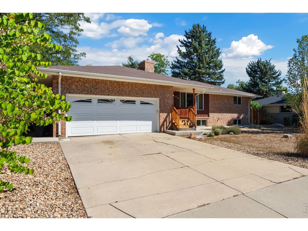 Opportunity Knocks! With close-proximity to schools, McIntosh Reservoir, parks, Twin Peaks Golf Course in NW Longmont this is a location where you can truly LIVE! Step under the front covered porch and onto the beautiful hardwood flooring which span the primary main floor areas. Just down the hall you will discover three bedrooms with a shared common bathroom and a private bath for the primary bedroom. The kitchen has sleek the full complement of stainless-steel appliances featuring a gas range and stunning slab granite counter tops. Close by is the dining space and a comfortable family room away from it all. Downstairs is a great place to go for all sorts of fun. The nice-size recreation room has a cozy fireplace and plenty of room for a pool table or open theater, and two additional bedrooms with a full bathroom nearby. This property is respectfully priced and with a little TLC outdoors it can really shine. Pre-inspection reports have been prepared for your confidence and convenience. Call today to schedule your own private tour.
