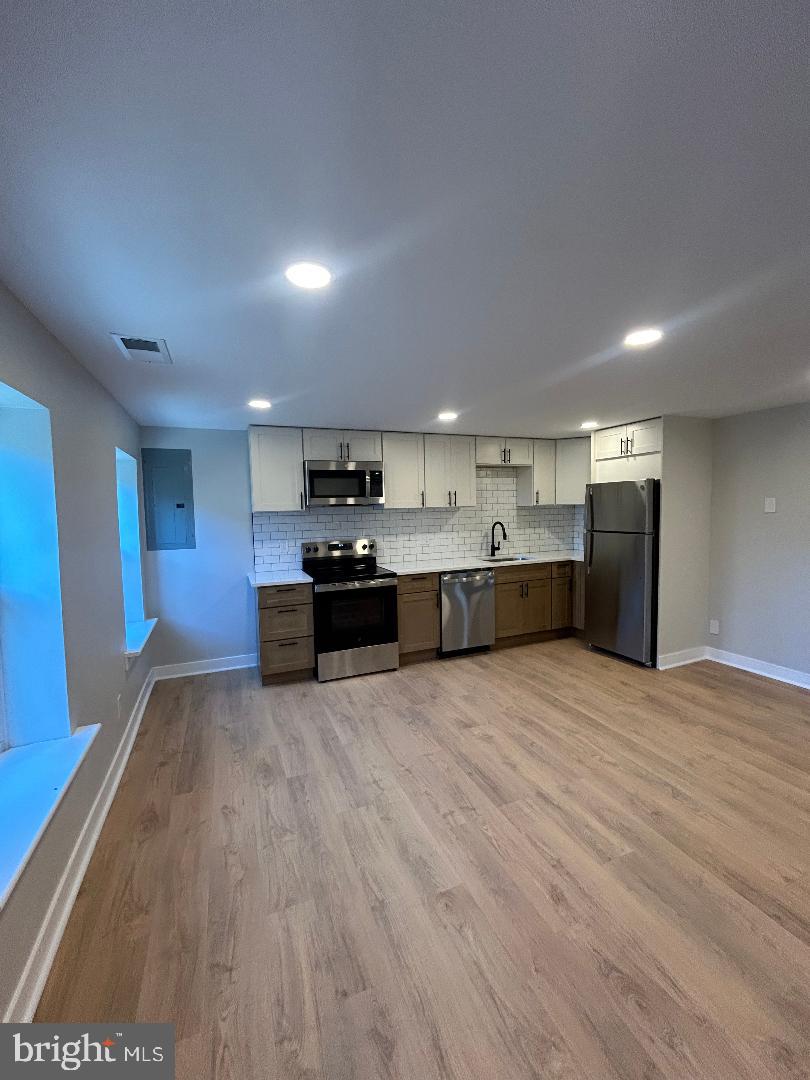 CONTACT LISTING AGENT TO INQUIRE ABOUT OUR RENTAL SPECIAL IF LEASE IS SIGNED BY NOVEMBER 1, 2026 AND ASK HOW TO GET ONE MONTH FREE. Be the first to enjoy this beautifully renovated 1 bedroom/1 bathroom + den 2-story apartment featuring modern finishes and thoughtful upgrades throughout. The apartment has been fully renovated top to bottom and features include in-unit laundry, central AC, LVP flooring throughout, all new kitchen with elegant quartz kitchen countertops, and all new en-suite bathroom. The den would make a perfect home office. Don't miss the opportunity to make this beautifully updated apartment your next home!  Optional parking $160.00/month.
