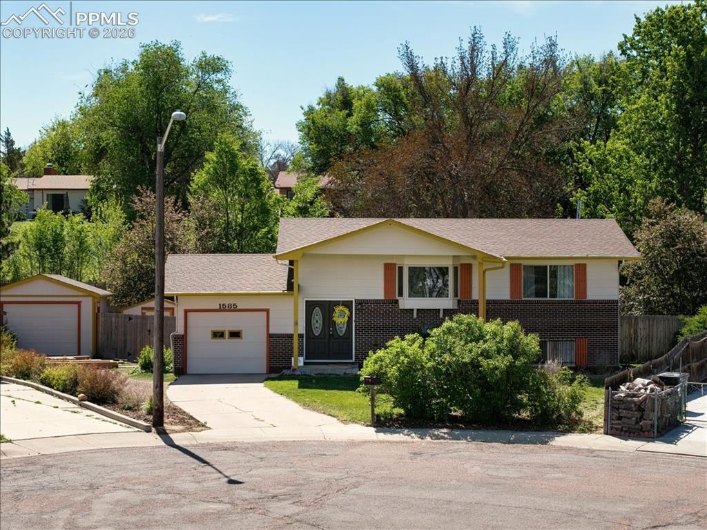 Nestled in a quiet cul-de-sac, this 3-bedroom, 2-bath home offers space, privacy, and convenience on a massive tree-filled lot. Enjoy the bright sunroom with abundant natural light, perfect for plant lovers or a relaxing retreat. The home features an additional living area in the basement, a storage room, an attached 1-car garage, detached 1-car garage, and outdoor shed for extra storage. A brand-new deck is being installed May 8th, creating the perfect outdoor entertaining space. Conveniently located near walking trails, Widefield Community Park, frisbee golf, Fort Carson, and Peterson Space Force Base.