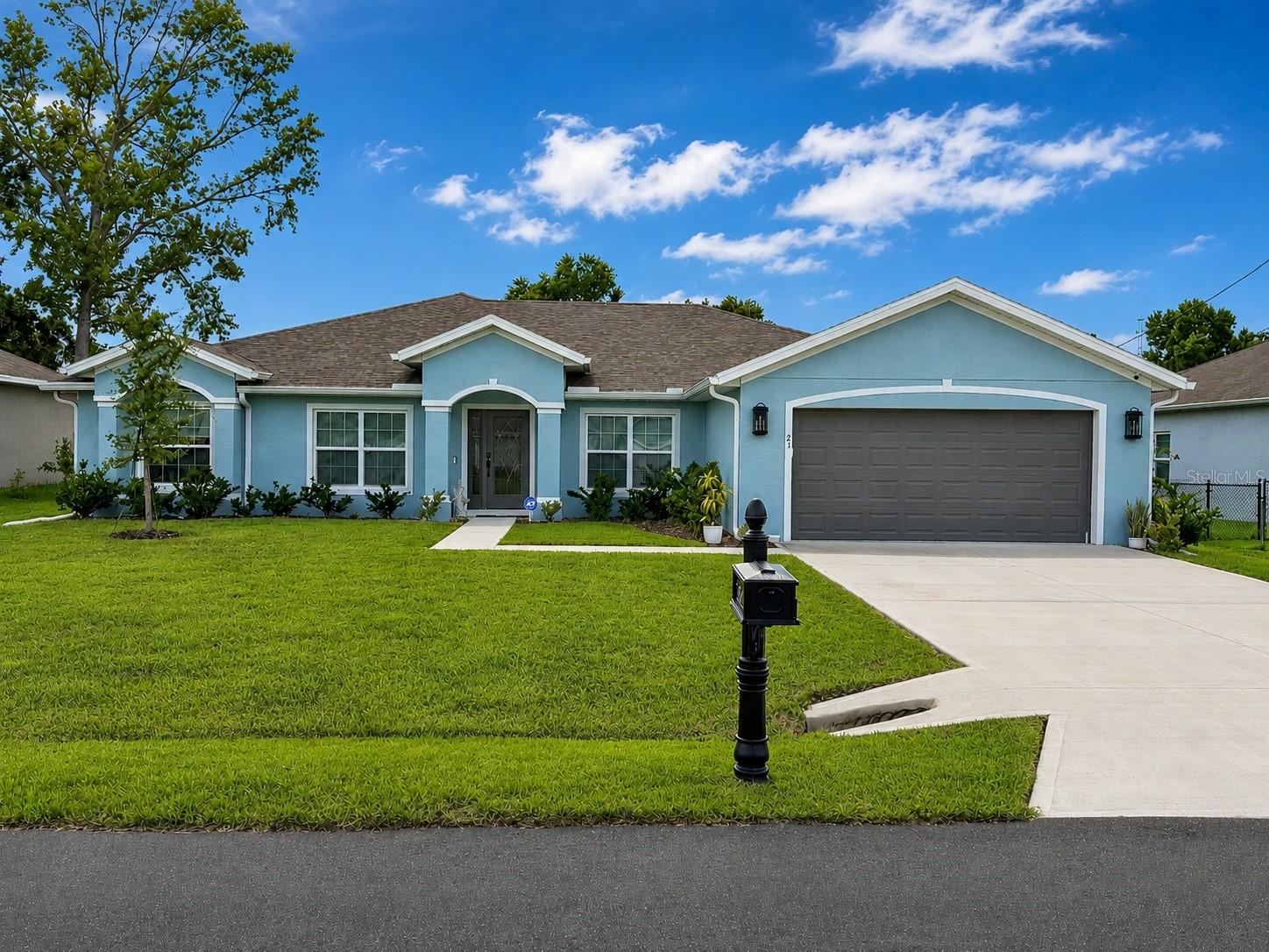 PRICE IMPROVEMENT - Exceptional Value!!!  Welcome to 21 Wood Clift Lane, where nearly new construction meets resort-style Florida living in the desirable Pine Lakes community. Built in 2024, this beautifully appointed SeaGate Homes Willow model offers 3 bedrooms, 3 full bathrooms, a versatile den/flex room and approximately 2,283 square feet of thoughtfully designed living space.At the heart of the home is an inviting open-concept living area that flows seamlessly into the kitchen and outdoor retreat. The kitchen features quartz countertops, stainless-steel appliances, 42-inch cabinetry and generous workspace for cooking and entertaining. Three-panel sliding glass doors open to the expanded lanai and an impressive screened outdoor living area featuring a heated saltwater pool and spa built in 2025.The spacious primary suite offers two oversized walk-in closets and a private bathroom, while the split-bedroom floor plan provides comfort and privacy for residents and guests. The den offers flexibility as a home office, media room, hobby space or additional guest area.This home is equipped with upgrades designed for comfort, convenience and peace of mind, including a 22 kW whole-house propane generator with two propane tanks, a whole-home Culligan water-filtration and softener system, an alarm system with four security cameras, carbon monoxide and smoke detection, whole-home gutters and window treatments.Additional features include irrigation, an attached two-car garage and the remaining balance of a 15-year structural home warranty. Renewable Termite Bond.Why wait to build or spend months coordinating major improvements? This move-in-ready home brings together modern design, valuable upgrades and a private backyard oasis—all ready to enjoy from day one. Schedule your private showing and experience the Palm Coast lifestyle at 21 Wood Clift Lane.