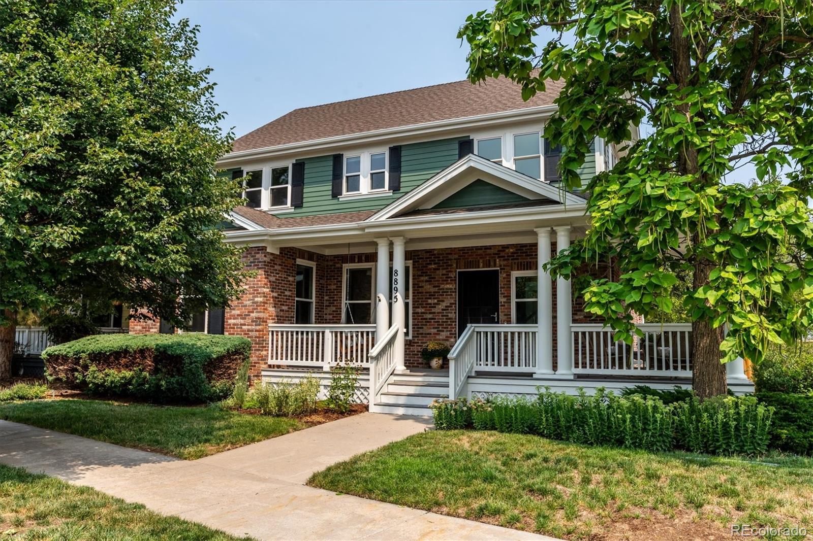 Beautifully updated & meticulously maintained, this 1-owner home blends timeless style with modern improvements. Perfectly situated on a corner lot, the inviting wraparound covered front porch creates the ideal place to enjoy Colorado's beautiful days! Fresh interior paint, newly refinished hardwood floors, and brand-new carpet make this home truly move-in ready. A dramatic vaulted foyer welcomes you inside, flanked by an elegant formal dining room before opening to the spacious great room, where a cozy fireplace creates a warm gathering space. All overlooking the beautifully remodeled kitchen that showcases white quartz countertops, designer tile backsplash, under cabinet lighting, prep island, pantry, & abundant cabinetry.  Tucked away for privacy, the main-floor office is conveniently located adjacent to the remodeled powder bath featuring marble finishes & classic wainscoting. Upstairs, oversized windows flood the staircase with natural light. 2 secondary bedrooms share a Jack-and-Jill bath, while the spacious primary suite features a beautifully remodeled 5-piece bath with quartz countertops, updated fixtures &lighting, frameless glass shower enclosure, & a soaking tub. Thoughtfully designed for studio-style living, the finished basement offers an ideal private retreat for a multigenerational living, extended guests, or flexible living space! Featuring built-in cabinetry, in-wall speakers, & a stylish kitchenette, this versatile space offers the potential for a non-conforming 4th bedroom and exceptional flexibility. Addt'l improvements: triple-pane windows (2021), exterior paint & new fencing (2025), Level 2 EV charger, 100 watt solar panel and 12V battery storage in garage, radon mitigation system, smart thermostat, electronic locks, whole-house humidifier, SimpliSafe security system. This lovingly cared-for home sits just moments from exceptional parks, trails, schools, pools, 2 Town Centers, neighborhood Rec Center, & Stanley marketplace!