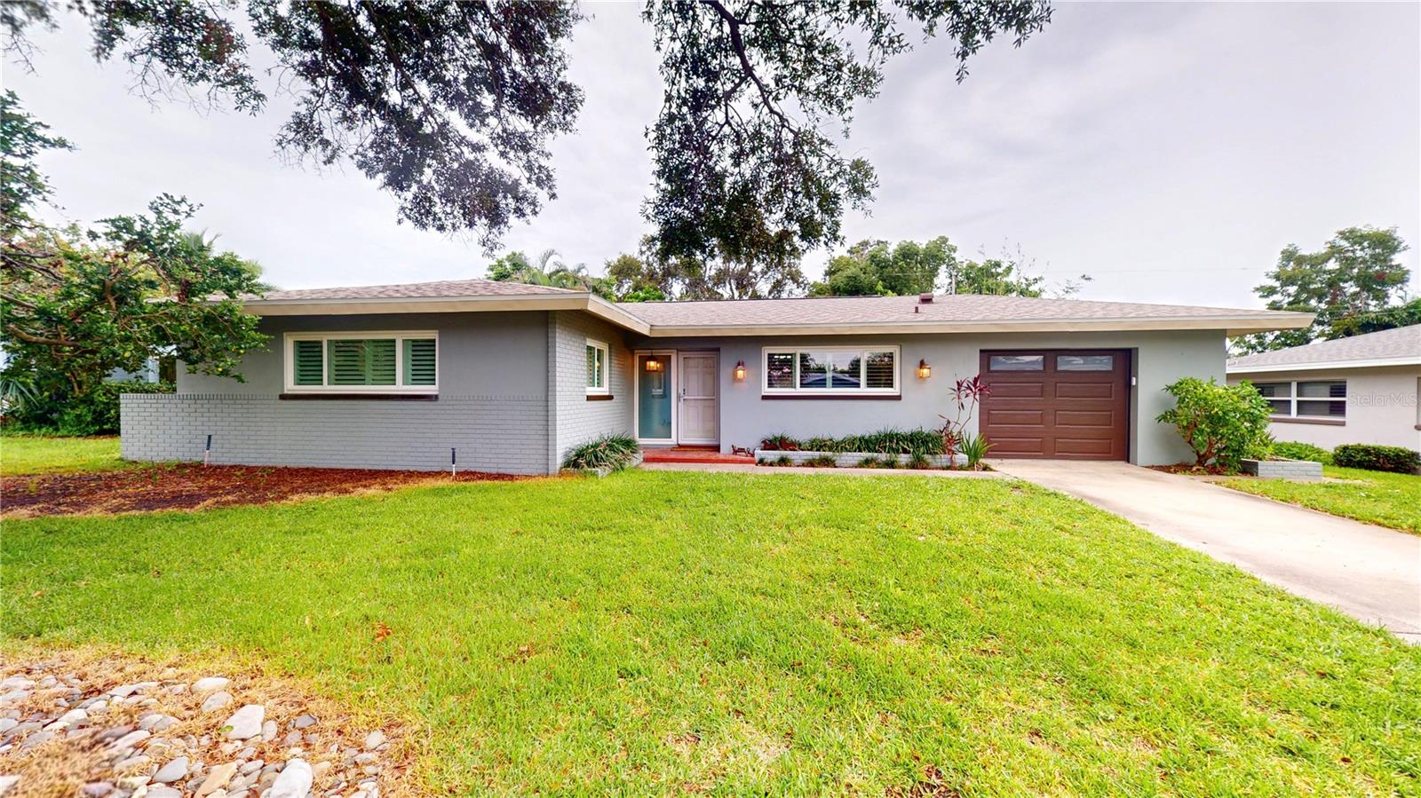 Welcome to this inviting 3 bedroom, 2 bath home in the heart of Largo offering comfort, style, and convenience. Step inside to find beautiful terrazzo floors throughout the main living area and a bright kitchen with stainless steel appliances. Sliding glass doors lead to the spacious Florida room surrounded by windows, perfect for relaxing or entertaining.

The laundry area is conveniently located in the garage just off the kitchen, and the home’s thoughtful updates include plantation shutters (2021) and a new roof (March 2025). Enjoy Florida living in the large backyard with a paver patio, ideal for gatherings or quiet evenings outdoors.

With no HOA, no flood insurance required, and a prime location just minutes to the Gulf Beaches and Largo Central Park Performing Arts Center, this home offers outstanding value and lifestyle.