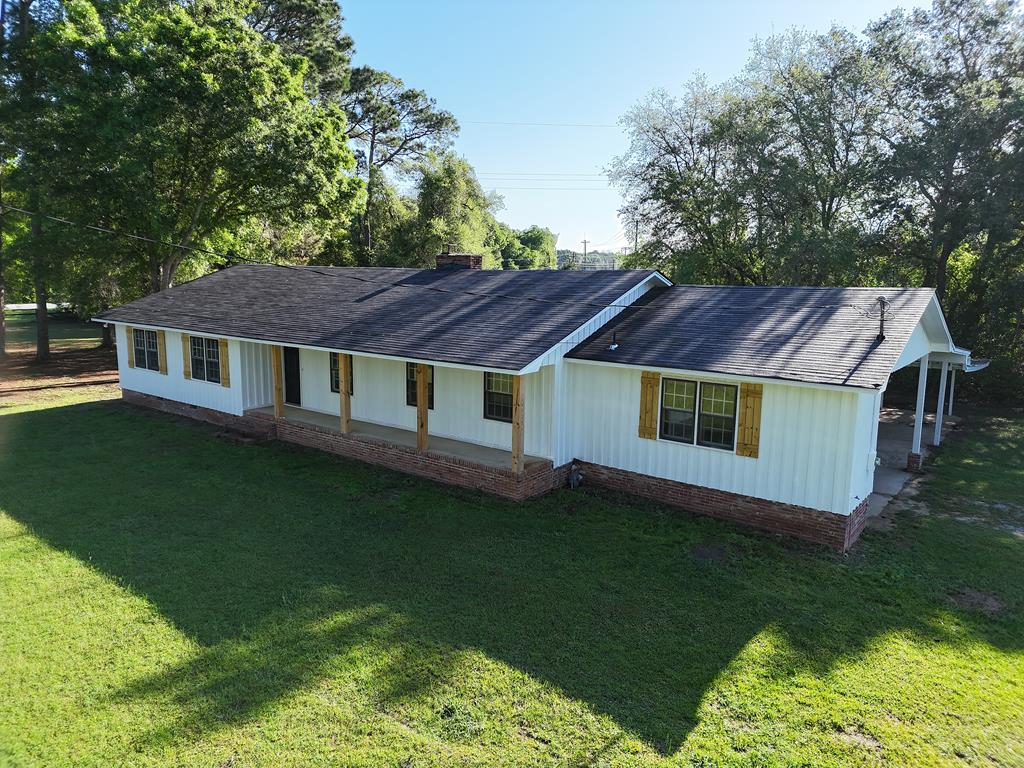 Don't miss this amazing home on Bailey Dr. in Camilla! This 5BR/2 Bath home has plenty of room for everyone, with lots of nice open living space. You will love the rustic hardwood floors and walls. Home features a big front living room, cute kitchen, fireside den and back bonus room WITH attached sunroom/laundry. There is plenty of parking under the attached carport, and plenty of room to roam on this 1+ acre corner lot. Call your favorite Realtor TODAY for a closer look at this amazing home.