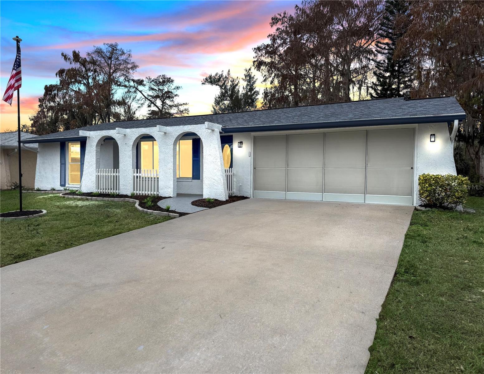 Welcome to this beautifully updated 3-bedroom, 2-bath home that has been completely remodeled and is truly move-in ready. The interior showcases fresh paint throughout, and the exterior has also been freshly painted. The kitchen features quartz countertops, stainless steel appliances, and luxury vinyl plank flooring runs throughout the home. The home includes a spacious double lanai, with one side designed as a sunroom and the other a screen room, providing the best of both worlds for year-round enjoyment. The backyard backs up to a serene wooded area that was once the Magnolia Valley golf course, offering privacy and peaceful views, and the property also includes a convenient storage shed. With a functional layout, spacious bedrooms, two full bathrooms, and upgrades throughout, this home delivers comfort, quality, and an inviting setting ready to be enjoyed.