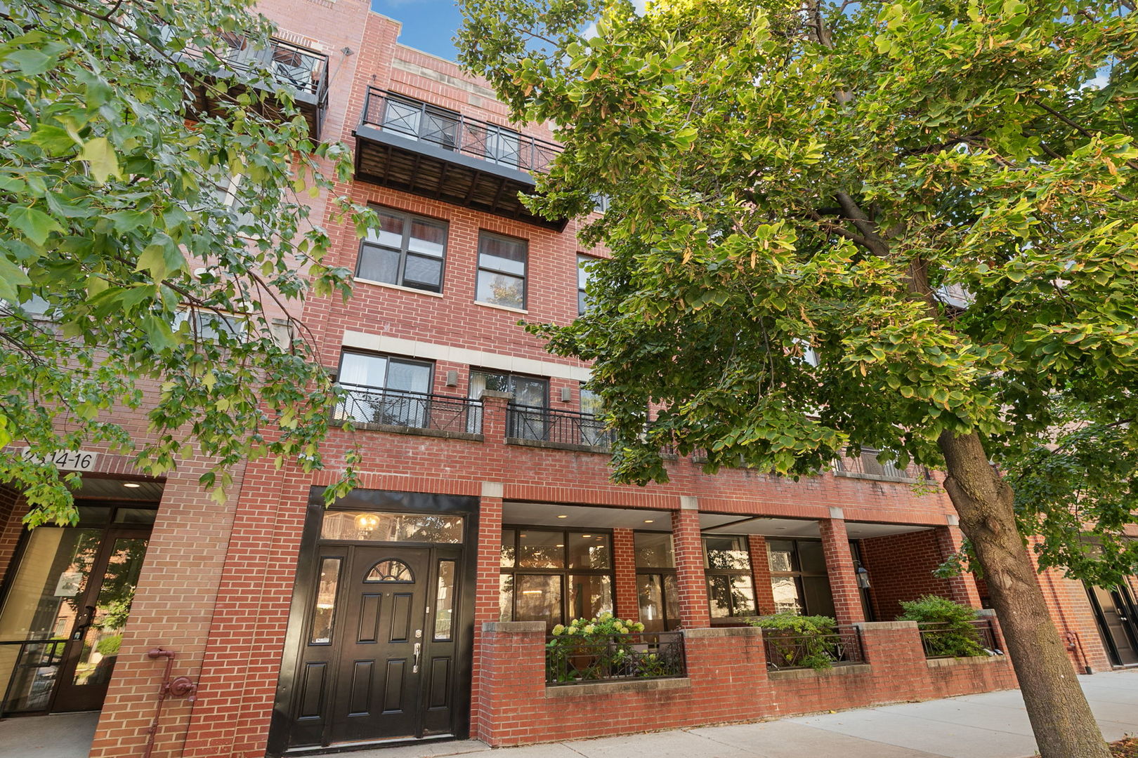 Welcome to sophisticated urban living in this bright and modern oversized 1-bedroom condo in the heart of Logan Square!    Enjoy an open-concept layout featuring a real fireplace, gourmet kitchen with granite countertops, stainless steel appliances and a spacious island-perfect for entertaining. Gleaming hardwood floors lead to a serene and expansive bedroom. Step outside to your private terrace on a quiet street, and take advantage of unbeatable neighborhood amenities: Target, bars, restaurants, Palmer Square Park and over 15 coffee shops within a mile.      Conveniently located just one block off Logan Boulevard, you're within walking distance to the Logan Square Blue Line and close to the 90/94 expressway. One assigned garage parking spot in a detached garage is included. Move-in ready-live where convenience meets charm!