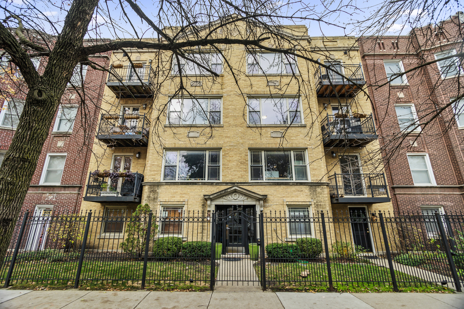 Welcome to this stunning south-facing 2-bedroom, 2-bathroom condo located on a picturesque tree-lined street in the heart of the Southport Corridor. Brimming with natural light, this beautifully updated home perfectly blends modern elegance with timeless charm. The spacious, open-concept layout is ideal for both entertaining and everyday living, anchored by a recently renovated kitchen featuring sleek finishes and ample room for a full dining table. French doors open to a private, south-facing balcony-an inviting space to enjoy your morning coffee or unwind at sunset. The sunlit living room boasts exposed brick, a cozy fireplace, built-in surround sound, and a warm, welcoming ambiance perfect for hosting guests or enjoying quiet nights in. Rich hardwood floors flow seamlessly throughout, including both bedrooms, adding character and sophistication.    The oversized primary suite offers a generous walk-in closet with custom built-in organizers and a luxurious en-suite bath. Both bedrooms are thoughtfully designed for comfort and privacy, enhanced by double-pane windows with added soundproofing for a quiet retreat from the city. Additional conveniences include in-unit laundry, two extra storage closets, and coveted parking-an exceptional perk in this sought-after neighborhood. Just steps from acclaimed restaurants, boutique shopping, vibrant nightlife, and the CTA Red and Brown Lines, this residence offers the very best of city living. Don't miss your chance to own a bright and beautifully appointed home in one of Chicago's most desirable locations!