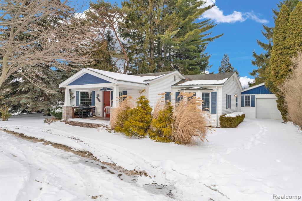 Charming 2-bedroom, 1-bath home located just two blocks from Lexington’s beautiful shoreline of Lake Huron. This property features an updated kitchen and a beautifully renovated bathroom complete with a custom tile shower, blending modern finishes with cozy cottage charm. The functional layout offers comfortable living space ideal for year-round living, or a vacation getaway. Enjoy relaxing on the covered front porch and entertaining in the secluded backyard, providing privacy and outdoor enjoyment. Additional features include a 16'x26' detached garage offering ample storage for vehicles, lake toys, or workshop space. Low-maintenance living in a prime location close to the beach, marina, parks, and downtown shops and restaurants. A great opportunity to own near the water in one of Michigan’s most desirable lake communities!