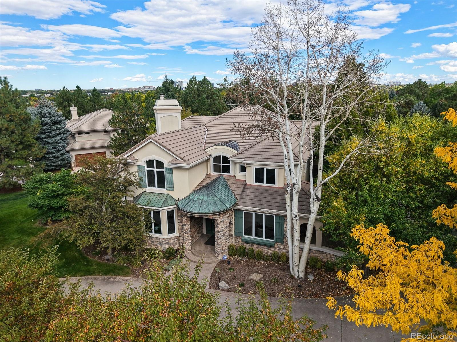 Your perfect Preserve home is here. Tucked away on a quiet corner lot, 5690 S Beech Circle offers a rare combination of recent renovations, exceptional privacy, and one of the largest yards in The Preserve. This is a unique opportunity and an ideal setting for a future custom pool or resort style outdoor living space. The home features a sun filled, open floor plan with expansive windows and fantastic flow throughout the main level. The chef’s kitchen is beautiful, showcasing Wolf and Sub Zero appliances, generous prep space, and seamless connectivity to multiple covered patios that are perfect for year round indoor and outdoor entertaining. The oversized backyard delivers remarkable flexibility, whether envisioned as a private lawn retreat, garden sanctuary, or pool centric outdoor oasis. Upstairs, the primary suite serves as a serene escape, complete with a spa inspired bath, walk-in closet, and peaceful separation from secondary bedrooms. Additional upper level rooms offer versatility for family, guests, or home office needs. The fully finished lower level further expands the home’s livability, featuring space ideal for a media room or recreation area, along with a fitness studio and guest accommodations with an en suite bathroom. Set within the heart of Greenwood Village, residents enjoy top rated Littleton schools, convenient access to DTC and Cherry Creek, and exclusive Preserve amenities including a private rec center with pool, tennis courts, trails, and surrounding open space. A distinctive blend of renovation, privacy, and outdoor potential, this is Preserve living at its finest. Don't miss your chance to make this gorgeous Preserve home yours today.