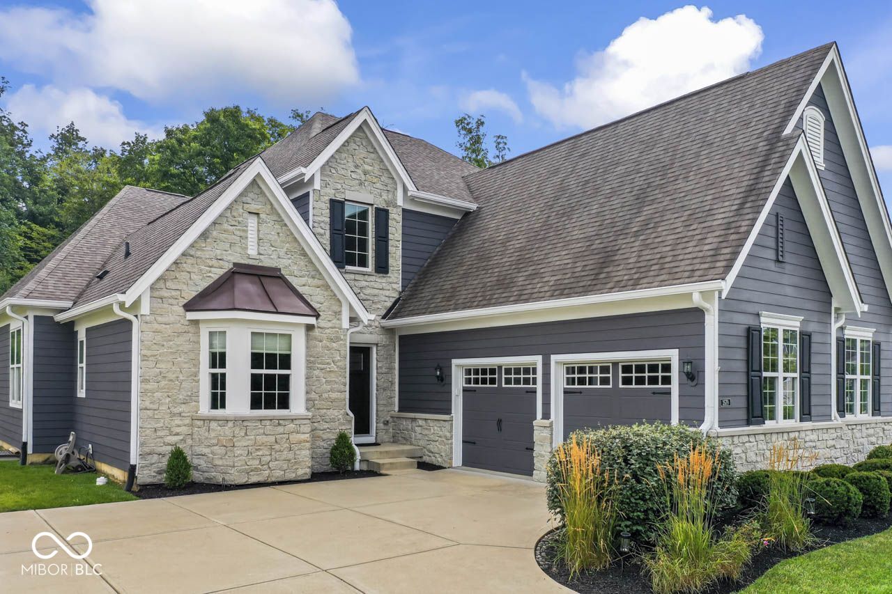 Don't miss this wonderfully cared-for home in popular Hidden Pines neighborhood.  This home sits next to an estate drive which creates an open feeling outside and gives privacy with the tree-lined backyard.  The exterior is freshly painted and landscaped with extra bushes and mulch beds.  Enjoy the evening on the Trex deck. The inside is everything you've been looking for - office, formal dining room, breakfast room, gas fireplace, primary on main level, white kitchen with butler's pantry, custom blinds and recessed lighting.  Two bedrooms upstairs share a jack-n-jill bathroom and stay cool with a dual zoned HVAC system.  The full unfinished basement has unlimited potential and is ready to suit your needs.  The two door, two car garage is super-sized for extra storage.  This home has all the upgrades to make it a truly special home.