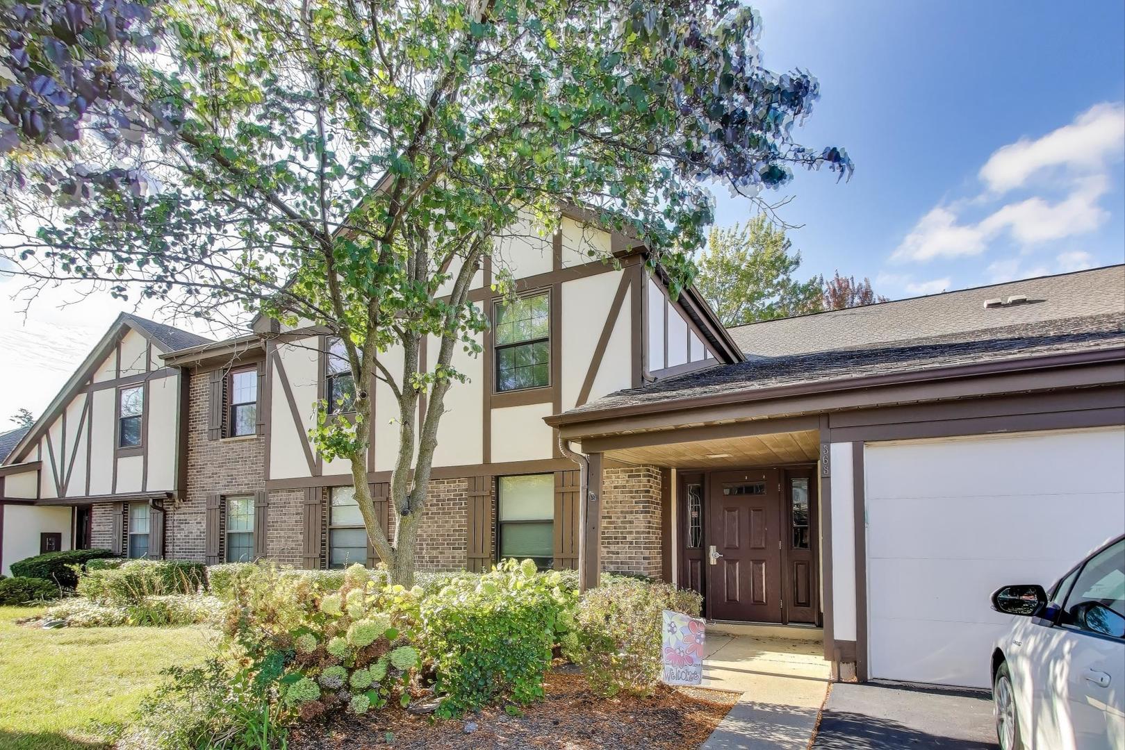 This inviting second floor home offers an open, light-filled layout with a large living room featuring a cozy fireplace and access to your private balcony through a sliding glass door. The separate dining room flows easily from the kitchen, ideal for entertaining. The open kitchen includes a casual dining area, large window and a second sliding glass door to the balcony for natural light. The large primary suite features a walk-in closet and updated en suite bath with a walk-in shower. A comfortable second bedroom has a large closet and easy access to the updated hall bath. Enjoy the convenience of in-unit laundry with full-size stackable washer and dryer plus room for storage. Additional storage can be found in the oversized 1-car garage. Recent updates include a new furnace (2024), A/C (2024), water heater (2021), and carpet (2022). Lexington Green II offers a pool, clubhouse with party room, and playground - all with low monthly HOA fees. Situated on a quiet interior street with easy access to parks, shopping, and expressways. In the attendance area of highly desirable Link Elementary, Mead Middle and Conant High School.