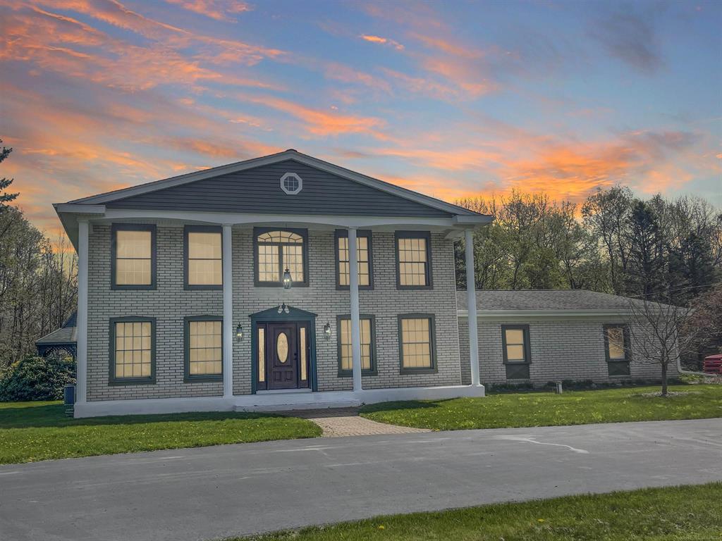 This unique colonial-style home sits on 20 breathtaking acres, offering the perfect setting for horse enthusiasts or those seeking privacy and space. With over 2,800 sq. ft. of living space, this home features 4 bedrooms and 2.5 bathrooms. The inviting great room showcases a natural wood-burning fireplace, while the kitchen is designed for entertaining with exposed brick, granite countertops, and a convenient snack bar. A formal dining room provides flexibility and can easily serve as a home office. Beautiful hardwood flooring runs throughout the main living areas. Upstairs, you'll find four spacious bedrooms, all with hardwood floors. The primary suite includes a full ceramic bath and a walk-in closet. There is a room off the garage that is heated and cooled that is perfect for a workout space and it includes a SAUNA!   Step outside to enjoy the in-ground pool, approximately 10 feet deep and complete with a diving board.  There is a bench seat in the outlet area of the pool that comes with a table and umbrella -perfect for summer fun. Relax in the backyard gazebo while taking in the scenic surroundings. The property is approximately 50% wooded and 50% open, groomed land-ideal for pasture use. Don't miss this one-of-a-kind opportunity to own a truly special property.