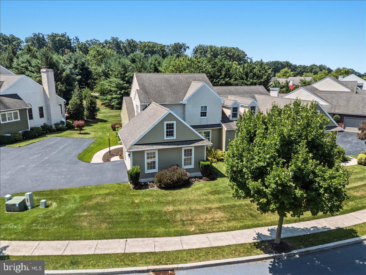 Welcome to this beautifully maintained home in the desirable community of Parkside. Set in a building of two, this home features luscious new carpet throughout the home, oak hardwood flooring, and three spacious bedrooms. The main floor features a spacious kitchen, a formal dining room, a living and the master suite. A half bath completes this first floor, conveniently located in the entryway. The master bathroom features a spacious walk-in closet, and a wheelchair accessible roll-in shower. Upstairs has two spacious bedrooms, a full bath, and an additional bonus room for storage or other uses. The unfinished basement is spick and span clean with the laundry also located there. With affordable HOA fees at $1,164 due annually, and the wonderful Livingood Park located nearby, this home is move-in ready and ready for its next owner. Come enjoy the many benefits that the owners have living in the Parkside community.