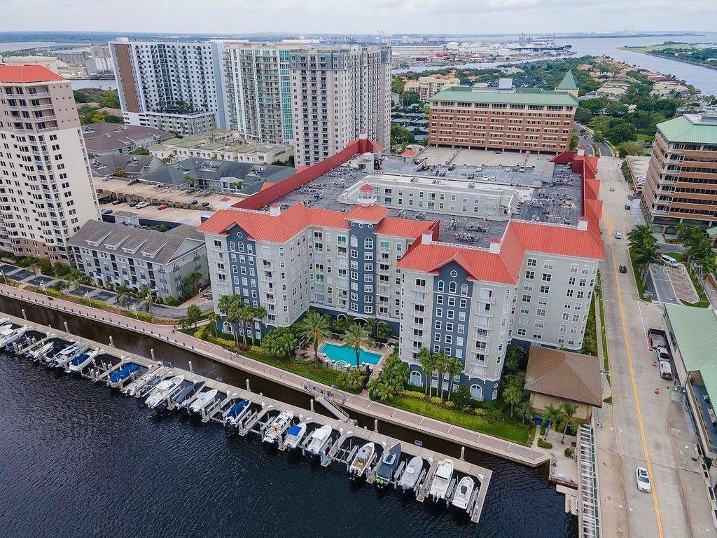 Reduced price. Seller motivated. Experience resort-style living in the prestigious Parkcrest Harbour Island Condominium, where luxury and convenience meet in the heart of Tampa! Milestone inspection successfully completed in 2022!! This well maintained 4th-floor condo offers a spacious open floor plan, view of the city and a glimpse of the water taxis and more. Two bedrooms and two bathrooms.! The kitchen features granite countertops, stainless steel appliances, a pantry, and a large island perfect for casual dining or entertaining. A nearby laundry room provides additional storage space for added functionality. The sunlit living area is designed for comfort, featuring elegant crown molding, an upgraded ceiling fan, and plenty of room for a dining table. Whether hosting guests or unwinding after a long day, this space offers both style and relaxation. The primary suite is a private retreat, complete with two closets (including a walk-in) and a luxurious en suite bath featuring granite countertops and a deep soaking tub. A second spacious bedroom and full bath on the opposite side of the home provide the perfect setup for guests or a home office. Enjoy top-tier community amenities, including Concierge service & 24-hour security, Resort-style waterfront pool & spa, State-of-the-art fitness center, Business center, billiards room & resident lounge and a Tranquil courtyard for relaxation. Located along Garrison Channel, Parkcrest is within walking distance to everything Tampa has to offer— Bayshore Blvd, Tampa River walk, Sparkman’s Wharf, Amalie Arena, Water Street, Tampa General Hospital, the TECO Street Car, Cross Bay Ferry, and an array of top restaurants, entertainment venues, and museums. Don’t miss this opportunity to live in one of Tampa’s most desirable communities! Schedule your private showing today. Parking Space #436 on the 4th Floor.