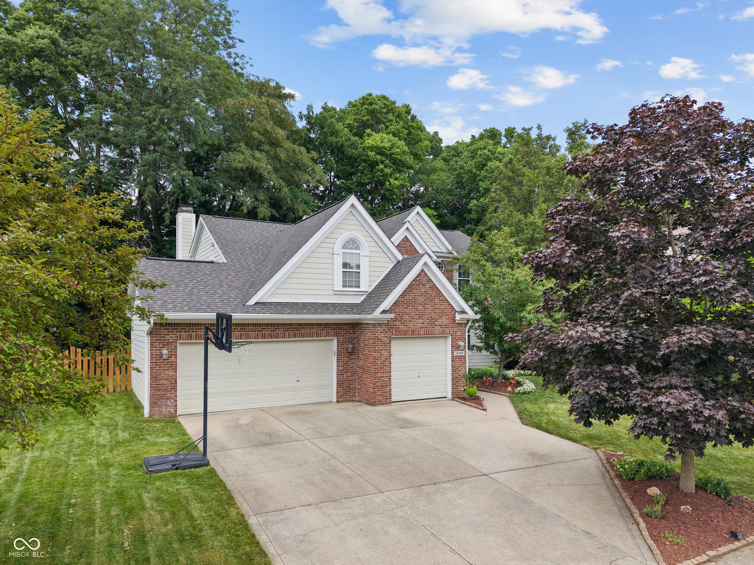 Seeking privacy, a spacious home and a quiet neighborhood in the heart of FISHERS? This beautiful 4-bedroom home with a finished basement is it! With over 4,000 sf of living space you will love this two-story home with a 3-car garage. The stately two-story foyer makes a striking first impression. The main level features new LVP flooring and a large living room ideal for hosting gatherings. The kitchen has bright, white cabinets, gorgeous quartz countertops, stainless steel appliances and an elegant backsplash. The breakfast room provides plenty of room for dining. The formal dining room, with its lovely French doors, is a wonderful flex space that can be used either for formal dining or as an office. The kitchen and breakfast room are open to the great room which feels grand with its high ceilings, yet inviting with its cozy fireplace and windows overlooking the wooded backyard. The large deck off the kitchen is perfect for entertaining! The mature trees and fully-fenced yard provide privacy when relaxing outside. Upstairs, you'll find four spacious bedrooms, including a large primary suite with an en suite bathroom featuring a jetted tub and separate shower. The nearly 1400 sf finished basement has loads of room for entertaining and plenty of space for storage! Located near downtown Fishers, highly-rated schools, Geist Reservoir, dining and entertainment, and with convenient access to I-69, you will not want to miss this beautiful home.