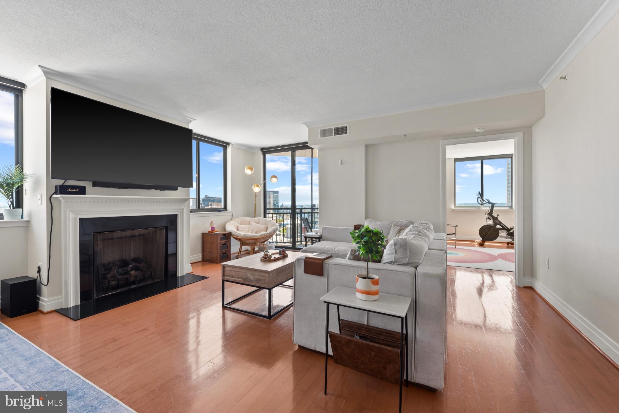 ****Seller will consider any reasonable offers and will pay the parking fee of 5,276.00 for one year with an acceptable offer****Welcome to 414 Water Street, a premier full-service condominium offering elegant, carefree living in the heart of downtown Baltimore. Perched on the 18th floor, Unit 1813 showcases sweeping eastern and southern views of the harbor and city skyline. A gracious entry foyer opens to a spacious, open-concept Living and Dining Room featuring a gas fireplace and access to a private balcony—perfect for enjoying thespectacular views. The well-appointed kitchen offers granite countertops, upgraded appliances, abundant cabinetry, and a raised breakfast bar ideal for casual dining. Designed for privacy, the two generously sized bedroom suites are located on opposite ends of the residence, each with its own ensuite bath. The Primary Suite features a whirlpool tub, separate shower, and a large walk-in closet. A versatile Den located between the Living Room and Primary Suite provides the perfect space for a home office, media room, or potential third bedroom. A conveniently located Powder Room is ideal for guests, while an in-unit washer and dryer add everyday convenience. The unit conveys with two deeded parking spaces. Residents enjoy an exceptional array of amenities, including 24-hour concierge and security, a fitness center with recently updated equipment, a business center, a party room/lounge, outdoor pool and  sundeck, and a hot tub.Ideally situated just minutes from both Johns Hopkins Hospital and UMMC, and steps from the dining, shopping, and entertainment destinations of the Inner Harbor, Harbor East, and Fells Point, this location offers the very best of city living.
