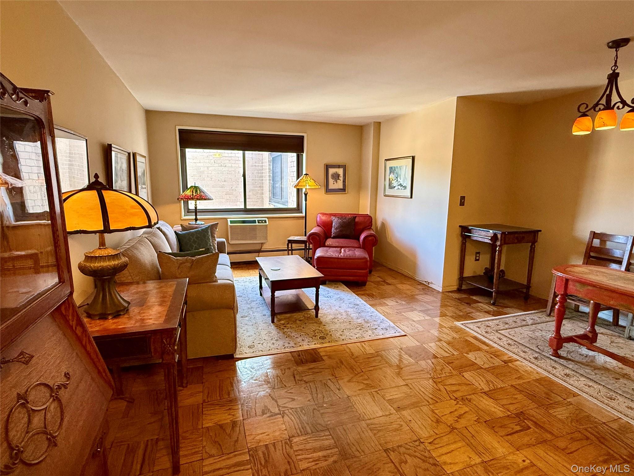 Top-Floor Unit in a Premier Hartsdale Location! Welcome to this bright and airy top-floor unit in a well-maintained luxury building, ideally situated just minutes from the vibrant village of Hartsdale. Enjoy easy access to the seasonal farmer’s market, Metro North (only 38 minutes to Grand Central), local shops, dining, and major roadways — offering the perfect blend of convenience and community. Inside, you'll find classic parquet floors, generous closet space, and an open floor plan ideal for modern living. The updated kitchen features granite countertops, rich wood cabinetry, and a built-in microwave, perfect for preparing meals in style. Two A/C units ensure year-round comfort. Additional features include: assigned garage parking, live-in superintendent, common laundry room, optional rental storage and bike space. Ownership perks include access to the Town of Greenburgh pool and park, a rare benefit for residents. Renting is permitted after three years of occupancy, with a maximum rental term of six years — a flexible option for future planning. There are no audio recording devices inside this property.