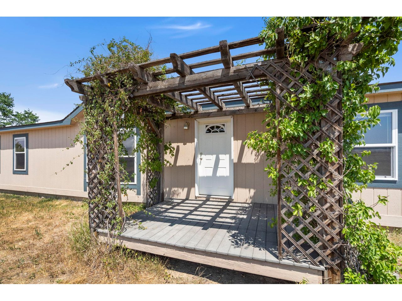 OPEN SATURDAY 11- 1. COME TAKE A LOOK! Enjoy 20.30 acres with wide-open Rocky Mountain views just 15 minutes to Old Town Fort Collins. This Northern Colorado property has 4 bedrooms, and 2 full baths and offers room to breathe without giving up convenient access to urban amenities. The acreage features mature trees, a seasonal pond, a fenced pasture with corral for your horses and livestock as well as plenty of room for gardens, recreation or simply the privacy and peace of acreage living. The ranch-style home offers comfortable single level living with a freshly painted interior. The spacious kitchen with ample cabinetry and workspace flows seamlessly to a separate dining room that opens onto the covered deck, perfect for outdoor meals and ending your day soaking in the Front Range sunsets. Looking west from the large living room bay window, the Rocky Mountain Front Range rises across the horizon. The primary suite with private bath includes a soaking tub, walk-in shower and double sinks. Three additional bedrooms provide flexibility for family, guests, hobbies or a home office. There are two walk-in closets for extra storage. High speed internet makes working from home easy and it is energy efficient with upgraded insulation. The 880+ sq. ft. detached 2-bay garage/shop features built-in shelving and workbenches, providing generous space for vehicles, equipment and your recreational gear. A 924 sq. ft. loafing shed, and an additional storage shed added even more value and utility. No HOA or Metro District. Rocky Mountain National Park is just over an hour away. It's the perfect combination of location, views, and versatility that's hard to find in Northern Colorado!