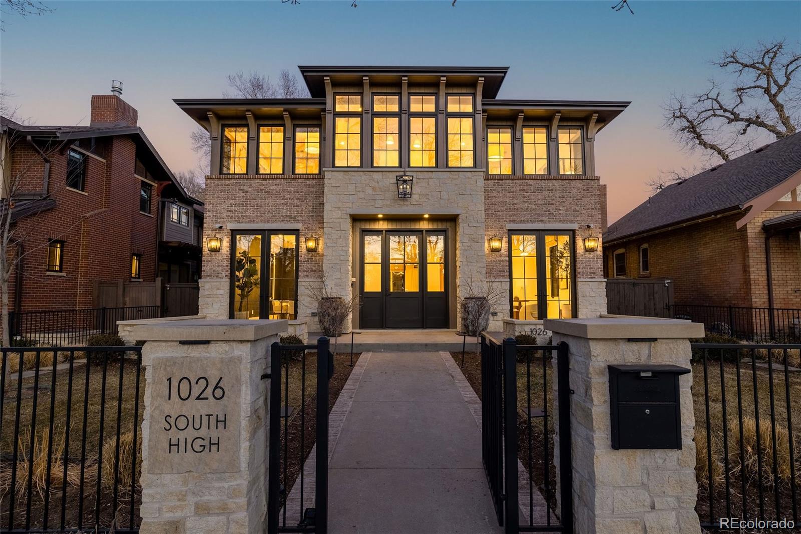 Designed to perfection by architect, Alvarez Morris, this Washington Park home is comprised of innovative design and breathtaking detail. Unique elements throughout the home include high, beamed ceilings, wide plank white oak floors, eight-foot doors, automatic shades and exquisite finishes throughout. Enjoy effortless entertaining in the formal dining room with temperature-controlled wine room, which leads to the well-equipped kitchen through a beautiful butler’s pantry. Featuring custom cabinetry, Cremo Delicato marble countertops, walk-in pantry and a huge center island, the chef’s kitchen adjoins a breakfast room as well as a comfortable great room with beamed ceilings and attractive stone fireplace. The great room opens to a private patio with firepit, built-in Lynx grill, Fontana Forni pizza oven, surround sound speakers, and built-in four-person Sisu sauna. The front and back yard have been professionally landscaped by Lifescape. Mud room and powder room complete the main level. Retreat to the private primary suite on the upper level, highlighted by a vaulted ceiling, stunning fireplace, automatic black-out shades, his and hers walk-in closets, as well as a spa-like five-piece bath featuring heated floors, toilet and towel rack, plus steam shower. Two additional bedroom en suites are found upstairs, along with a convenient laundry room. Fourth and fifth bedrooms are located in the lower level, as well as a three-quarter bath, huge rec room with wet bar, an exercise gym, and storage/mechanical rooms.The home is truly state-of-the-art, including Sonos throughout, water filtration, two HVAC systems, two Tesla chargers, security system including cameras in front and back, plus solar panels. Situated on a wonderful Wash Park block, this home is an entertainer’s dream, complete with upscale finishes and careful attention to architectural detail.