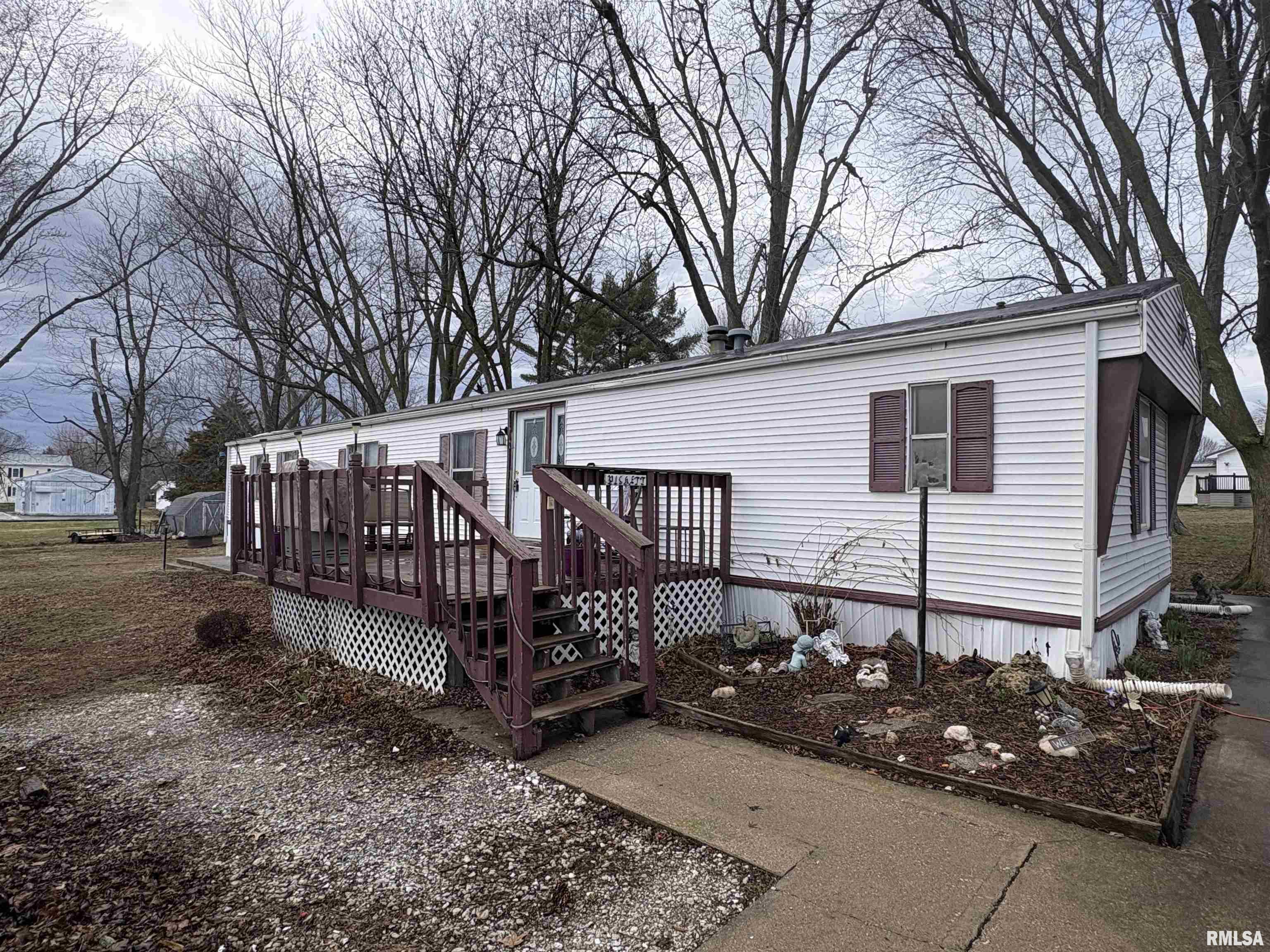 Welcome to this charming 3-bedroom, 2 full bath mobile home situated on its own spacious 0.34-acre lot in Payson. This well-maintained property offers comfortable living with plenty of room both inside and out. Enjoy the convenience of a double-car carport, providing ample covered parking. In addition, the property features three separate outbuildings—perfect for extra storage, workshop space, or hobby use. Located just steps away from the local gas station and Dollar General, this home offers everyday convenience while still providing the privacy of its own lot. Whether you're a first-time homebuyer or looking to downsize, this property presents a wonderful opportunity to own an affordable home in a convenient location. Don’t miss your chance to make this property your own—schedule your showing today!