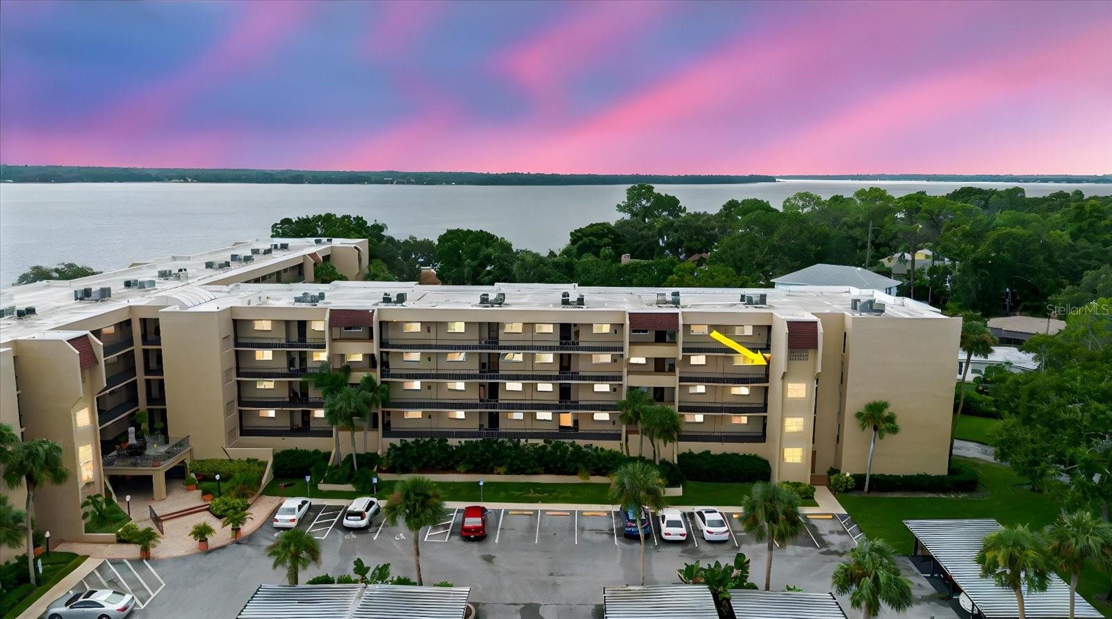 Discover the perfect blend of comfort, convenience, and Florida charm in this beautifully updated, move-in ready 3rd-floor condo. Tucked safely in a no-flood zone and paired with a low HOA fee, this home is designed for easy living and peace of mind. Offering 2 bedrooms, 1 bath and a deeded covered parking spot plus extra storage, this condo truly has it all. Inside, you’ll find a bright, open floor plan where the kitchen, dining, and living areas flow seamlessly together—ideal for both entertaining and everyday living. The spacious master suite features access to the private balcony, while the second bedroom is equally inviting with plenty of natural light. The living room also opens to the balcony, where you can relax with serene lake views. Convenience is key here, an elevator in the building ensures easy access, while impact windows add extra comfort and security. Step outside and enjoy the resort-style amenities that make this community so desirable. Spend your days lounging by the heated pool, staying active in the fitness center, or enjoying a game of tennis, pickleball, or shuffleboard. Unwind with a book in the library, challenge friends at billiards, or host gatherings in the clubhouse. Love the out doors? Take advantage of the BBQ area, go fishing on Lake Tarpon, or enjoy boating and skiing with access to private docks and slips. The HOA covers water, sewer, trash, exterior maintenance, insurance, and full access to recreational facilities, ensuring easy ownership. Located just minutes from Tarpon Springs’ historic Sponge Docks, downtown shops and dining, pristine beaches, golf courses, parks, hospitals, and the Pinellas Trail, this condo offers both convenience and charm—making it the perfect place to call home or use as a seasonal retreat. Don’t miss the chance to enjoy the Florida lifestyle you’ve been dreaming of!